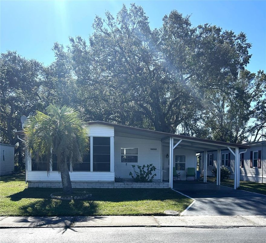 PRICE REDUCED!!! WELCOME TO SHADY OAKS! Home is in need of some floor repairs, but with just a little . TLC this home could easily become your forever Florida home or your relaxing Florida retreat. Shady Oaks is a 55+, pet friendly park where you own your land. This is a great opportunity to become part of a great community and in a GREAT LOCATION! Home features two enclosed porches, a carport, indoor laundry unit off one of the enclosed porches and best of all a shaded back yard with no neighbors behind you which is great for both privacy and entertaining. Community offers low HOA fees just $500.00 a  year , a community pool, a clubhouse, shuffleboard, pets and golf carts are allowed and lots of activities to keep you busy throughout the year. Don't miss out on this rare opportunity to make this home your own at a great price. 
Private financind available Call for your showing today!
