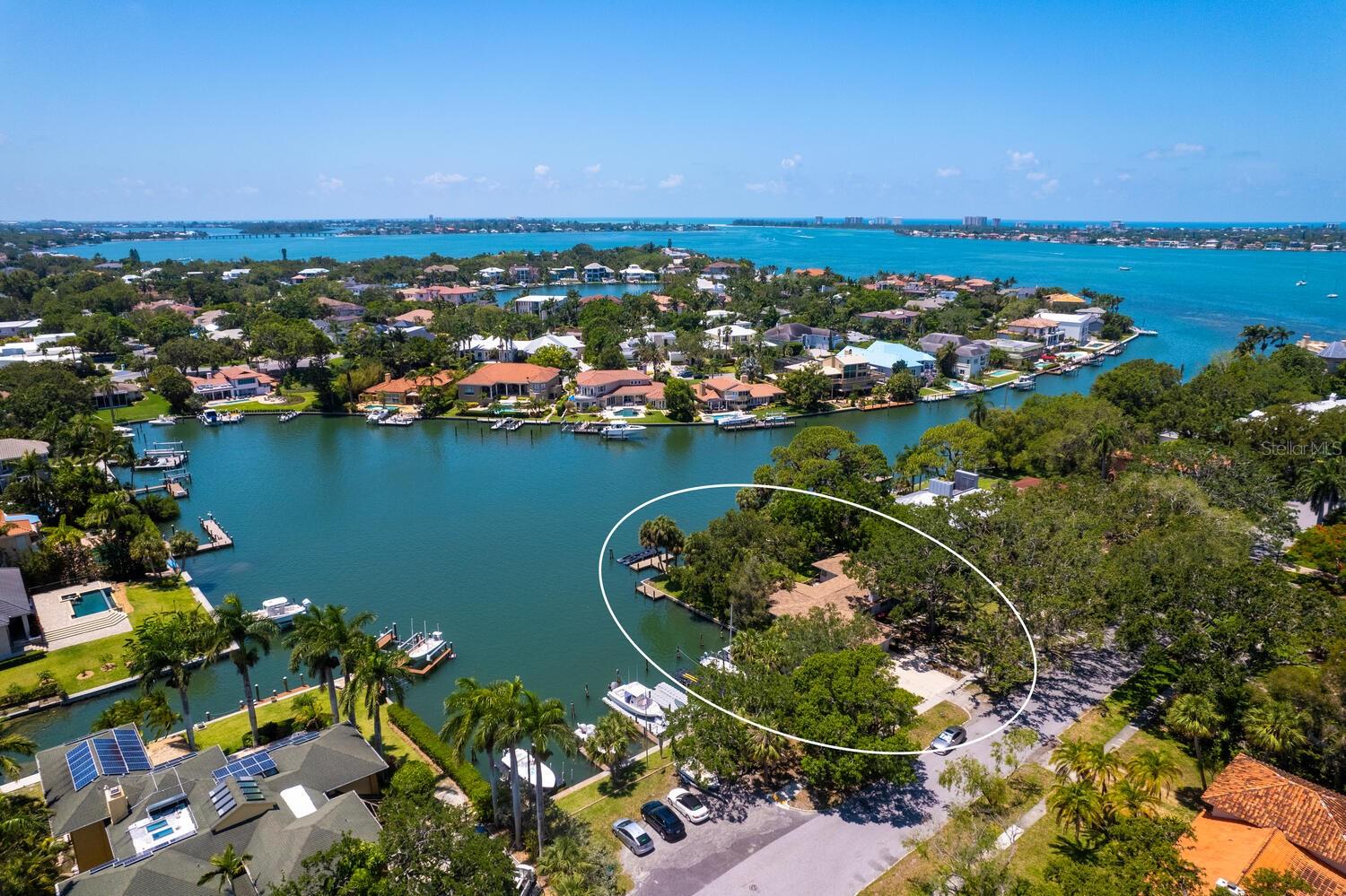 Available for the first time in over 40 years, discover the perfect canvas for your dream home on this exceptional waterfront lot, located in the highly sought-after neighborhood of Bay Point Park. Nestled along serene protected waters, this spacious parcel is surrounded by nearly 200 feet of water and offers an unparalleled opportunity to create your personal sanctuary with unobstructed panoramic views. Whether you envision a modern estate, a charming cottage, or a luxurious retreat, this lot provides the ideal setting to bring your vision to life. With direct water access and no bridges to the bay, enjoy two private dock possibilities, fishing, kayaking, and unforgettable sunsets right from your doorstep. The lot boasts 13,500 square feet and water on two sides, offering a perfect vantage point for picturesque views while maintaining privacy and seclusion. Located in a peaceful and highly desirable area, you will enjoy both tranquility and convenience, with close proximity to local amenities, shops, and dining. Just minutes to Marie Selby Botanical Gardens, downtown Sarasota, and Southside Village, enjoy the lifestyle that is unique to this neighborhood. Whether you are looking to build your primary residence or a vacation home this lot offers endless possibilities. Don't miss this opportunity to own a piece of prime waterfront real estate and start creating the lifestyle you have always dreamed of!