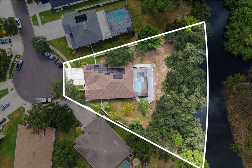 Discover a rare waterfront retreat in the Tampa Bay area, offering privacy, nature, and unbeatable convenience. Located just minutes from Westchase, Tampa International Airport, and downtown, this property is ideal for buyers seeking tranquility without sacrificing access to city life. Set on nearly half an acre, the lush, tree-lined lot provides ample space for outdoor entertaining or peaceful relaxation. The spacious interior layout suits large families and multigenerational living. Enjoy direct access to open water—perfect for boating, fishing, or simply unwinding by the dock.
This energy-efficient home features TESLA Powerwall batteries, solar panels, an EV charger, and a whole-house water softener with carbon and UV filtration—combining sustainability with modern comfort. With an elevation above 10 feet, the property remained safe and dry during recent hurricane events—no flooding and no damage. This added peace of mind makes it a smart choice for long-term ownership.
Low HOA and generous lot dimensions for future customization.
Close to parks, new commercial developments, top-rated schools, and major highways, this home is a smart choice for families, professionals, or vacation seekers. Don’t miss the opportunity to own a piece of Tampa’s exclusive waterfront lifestyle—where location meets livability.