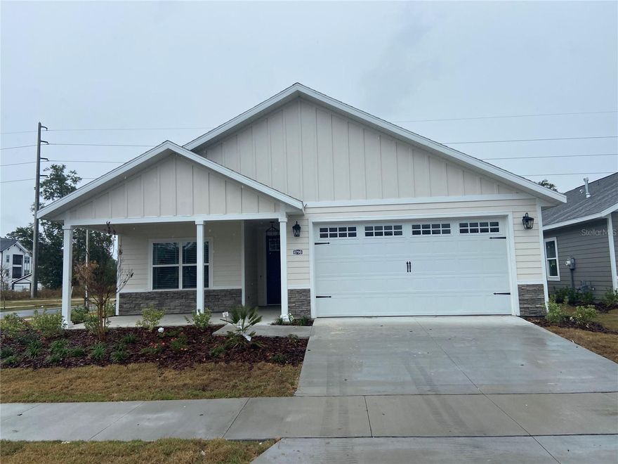 This 2023 LEIGH ANN plan consists of 4 BEDROOMS AND 3 BATHROOMS 1870 SF situated on a corner lot with a 20 foot buffer behind and across from the POOL and playground! FULLY FENCED BACKYARD. The 9ft ceilings with tray are in the living room and owner’s suite. There are NO CARPETS with Luxury Vinyl Planks in main rooms and bedrooms and ceramic tile in most wet areas. Kitchen and baths boast shaker style soft close wood cabinets and quartz countertops. Appliances include a GAS COOKTOP WITH EXHAUST HOOD, DISHWASHER, BUILT IN OVEN AND MICROWAVE, REFRIGERATOR, WASHER AND DRYER, A GAS TANKLESS WATER HEATER, CEILING FANS AND HVAC 15-SEER. Grand Oaks is convenient to Celebration Point, Butler Plaza, UF Health, The University of Florida, NFRMC, I-75. Grand Oaks is a pool community with a covered pavilion and playground. Renters insurance Required. No unseen applications accepted. Photos represent the property condition before the current occupants moved in.