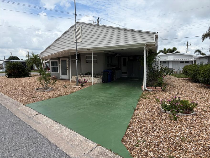 Discover the possibilities of this distinctive 2-bedroom, 2-bath property, where you own the land with no lot lease. The home also offers the potential for a third bedroom or den, along with a spacious laundry room and an expansive living area. Conveniently located just minutes from the airport and the bay (approximately 1.5 miles and 2.5 miles away, respectively), this property offers both accessibility and charm. Encompassing approximately 1,100 square feet, the home is situated on a generous corner lot accented by attractive river rock landscaping. Whether you choose to renovate the existing residence or build anew, this property presents an inviting opportunity to create something truly your own.
Tri-par Estates is a 55+ community that provides a wealth of amenities: enjoy a heated and cooled large pool for year-round swimming, a brand-new spa, tiki hut, pickleball courts, fitness center, shuffleboard, miniature golf, horseshoes, and various recreation hall rooms equipped with ping-pong, billiards, card tables, a kitchenette, sewing areas, and more. The expansive clubhouse regularly hosts dinners, dances, and other events.
Situated only minutes from downtown Sarasota, you’ll have easy access to marinas, shopping, restaurants, museums, the world-renowned Siesta Key and Lido Key beaches, and Sarasota airport.
In this special park and recreation district, residents own their land directly, with no separate HOA fees—an annual fee of $1,648 is included in your property taxes. Internet and TV included in the annual fee This is also a golf cart-friendly community with optional RV or boat storage when available. Don’t miss the opportunity to join this lively, well-established neighborhood in paradise.