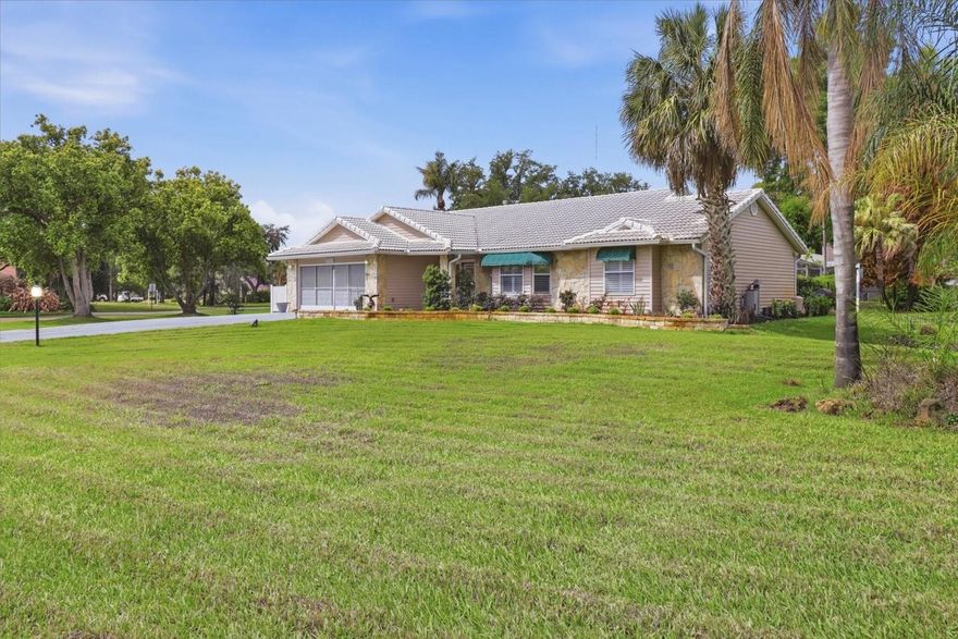 Seller is offering $5,000 towards closing costs!!!  Nestled in a charming boating community along Haines Creek, this beautifully maintained 3-bedroom, 2-bathroom SALT WATER POOL home offers the perfect blend of comfortable living and the Florida waterfront lifestyle you've been dreaming of. From the moment you arrive, the classic cement tile roof and manicured surroundings set the tone for everything this home has to offer.  Inside, you'll find generous living spaces designed for both everyday life and easy entertaining. The spacious living room and separate family room give everyone room to spread out, while the formal dining room is perfect for gathering around the table with family and friends. The GAS FIREPLACE adds ambiance and a cozy feel.  Elegant plantation shutters throughout the home add a timeless, polished touch to every room.  The kitchen is sure to impress, featuring a breakfast bar perfect for casual meals, sleek stainless steel appliances, and a gas range for the home chef who loves to cook. The breakfast eating area just off the kitchen is the ideal spot for morning coffee and conversation. The inside laundry adds everyday convenience, keeping life simple and organized.  Peace of mind comes built-in with a host of important updates, including a brand new electrical panel installed in 2026, a new 70-gallon gas water heater, and a new irrigation pump for the well — so the big-ticket items are already taken care of.   The home also includes a whole house water filtration system, plus Solar panels keep the pool heated efficiently, letting you enjoy a warm swim any time of year while keeping energy costs in check.  The heart of the home flows seamlessly to the outdoors, where your own private screened pool enclosure awaits — perfect for year-round swimming, relaxing, and soaking up the Florida sunshine in total comfort. A handy storage shed means there's a place for everything, from lawn equipment to lake toys.  The 2-car garage, complete with a garage door screen, lets in the fresh breeze while keeping pests out — a true Florida bonus.  Best of all, life here goes beyond your own backyard. As part of a wonderful boating community, you'll enjoy direct access to a boat ramp on Haines Creek, your gateway to the world-famous Chain of Lakes. Whether you love fishing, cruising, or simply taking in breathtaking sunsets on the water, this community puts it all within easy reach.  Don't miss your chance to own a piece of the Florida dream — schedule your private showing today!  Community offers boat storage (wet and dry) for a small fee.