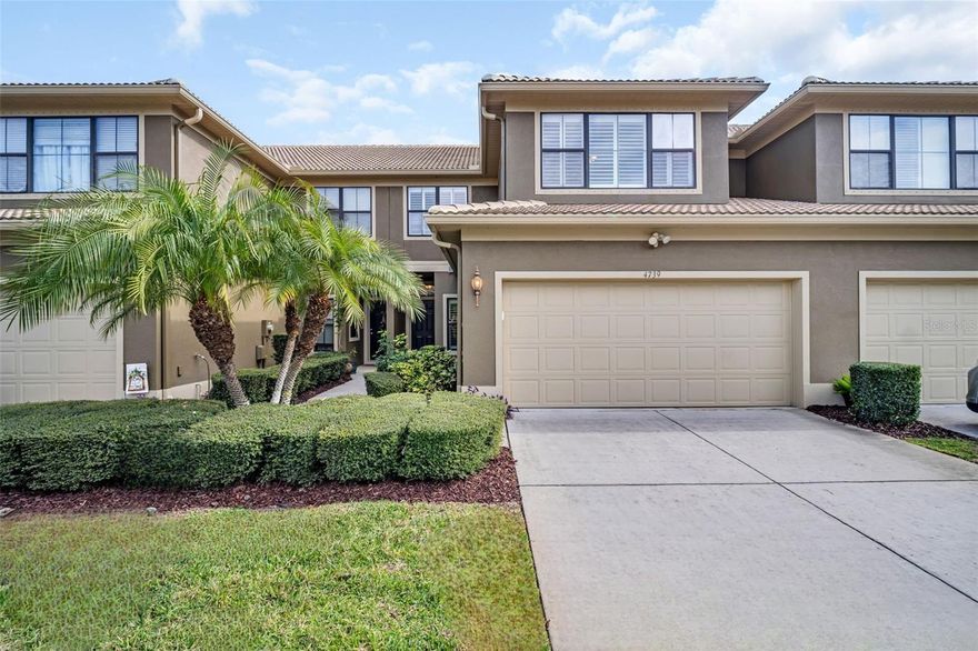 This is the one you’ve been searching for! Welcome to an unparalleled luxury townhome in the gated Tarpon Ridge community, offering nearly 2,300 square feet of sophisticated living in an unbeatable location. Just steps to the heated community pool this exceptional residence showcases soaring 18-foot cathedral ceilings, custom plantation shutters, crown molding, beautiful wood-look laminate plank flooring, and oversized windows that flood the home with natural light, along with an attached two-car garage and large indoor laundry room. The thoughtfully designed floor plan features a first-floor primary retreat and convenient half bath, while the upper level offers private guest bedrooms and baths, a dedicated office or flex space, and a massive loft-style bonus room with a dramatic overlook to the living area below. The chef’s kitchen is beautifully appointed with stainless-steel appliances, granite countertops, 42-inch cabinetry, recessed lighting, and a cozy breakfast nook. The primary suite is a true oasis with private slider access to the screened lanai, serene pool views, and an updated en-suite featuring dual sinks, a glass-enclosed walk-in shower, a built-in closet, plus an additional stunning walk-in closet with custom cabinetry. The screened lanai provides bonus living space not included in the heated square footage and can be enjoyed year-round. Enjoy peace of mind with a recently passed and transferable 4-point inspection—no insurance worries here. This home is NOT a condo, and the reasonable monthly fee includes exterior maintenance, lawn care, trash service, and the heated community pool. Ideally located in desirable Palm Harbor with easy access to top-rated schools, shopping, dining, hospitals, airports, beaches, parks, and golf courses, this is an exceptional opportunity to enjoy the Florida lifestyle in the sought-after Tarpon Ridge community. Schedule your showing today! Some photos have been virtually staged.