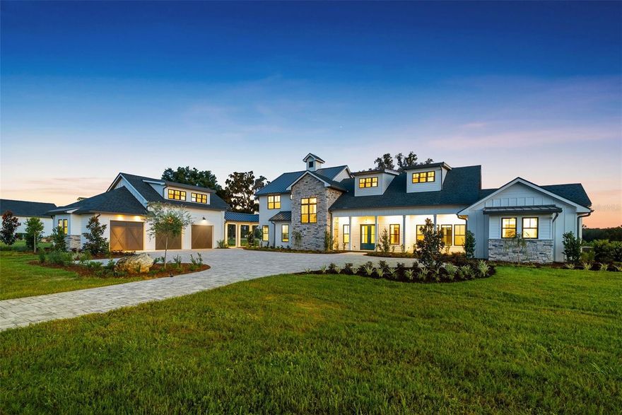 Nestled in the heart of Ocala, FL horse country and surrounded by over 8,000+ acres of preservation, this is a unique and rare opportunity to live your luxury in a brand-new construction model home (2025) on an equestrian-compatible parcel in the gated community of Bel-Lago. This two-story estate spans over 5,000+ sqft of refined living space on over 9+ pristine acres, adorned with a picturesque pond, majestic palms, and Live oaks - a true portrait of natural Florida. The home’s open design is made welcoming through the generous use of organic textures and design features, with Douglas fir cathedral ceilings, coffered ceilings with inlays, white oak engineered hardwood flooring, natural stone fireplaces and accents, and a warm earth tone color scheme, all accentuated by tremendous natural light from the Andersen windows throughout. The main residence features a functional floorplan of 3 bedrooms + study, 3.5 bathrooms, kitchen, dining room and sunroom. Upon entering the home, the grand atrium is the perfect entryway leading you into the formal sitting area, featuring large slider windows, cathedral beamed ceilings, and a dual-room fireplace. The home flows seamlessly into the true chef’s kitchen and dining area with granite countertops + backsplash, a large eat-in island, ample cabinet storage, and stainless steel Thermador appliances - even (2) dishwashers. Retreat to the tile-floored sunroom with incredible views of your pastoral oasis. This room offers a cathedral Douglas fir ceiling, accordion patio doors, and picture windows, all centered by a stone gas-burning fireplace. The owner’s suite is cozy and intimate with its stone fireplace, and en-suite bathroom with his/her closets, two private toilets, large dual-vanity, walk-in shower, and glamorous free-standing tub. The spacious study, framed by windows and built-ins, offers inspiring views and warmth from a shared fireplace with the grand atrium entry. Upstairs, you have two more guest suites with spacious closets and tiled en-suite bathrooms, along with the main electronics closet which enables smart-home remote control of select house lighting, Wi-Fi, stereo, and smart TVs throughout the house. The spacious 3-car garage includes a finished A/C 2nd floor for recreational use or storage space. An attached outdoor shed is added for convenience of your garden tools and supplies. Equestrian-ready with access to trails from your backyard, this is a rare opportunity to live immersed in nature, luxury, and possibility. Bel-Lago includes a gatehouse, multiple feature lakes, a multi-use internal trail system, and HOA. Enjoy your private oasis in Ocala horse country, while being minutes away from restaurants, grocery stores, and hospitals, 25 minutes to the World Equestrian Center, and only 1.5 hours away from Orlando and Tampa.