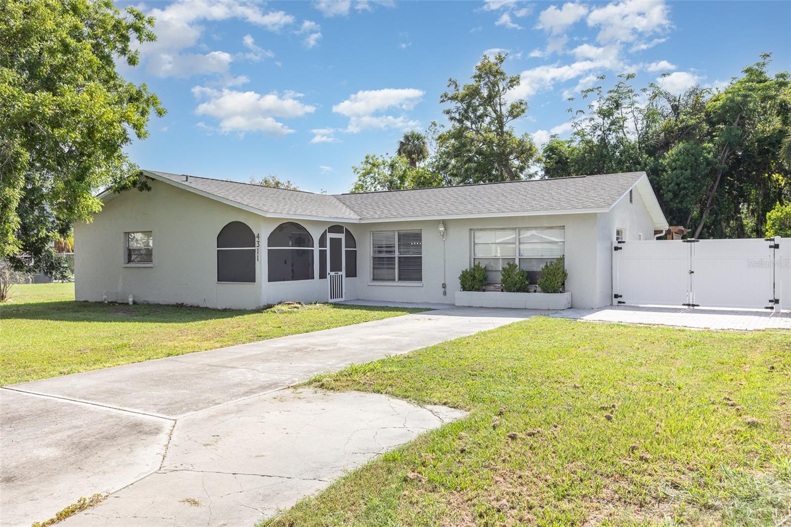 **Seller Paying Off \$30,000 Solar Lease at Closing—Enjoy Power Bills as Low as \$25/Month!** This versatile and energy-efficient 4-bedroom, 2-bath home in a quiet Palmetto neighborhood offers the perfect blend of upgrades, flexibility, and long-term savings. With no HOA or CDD fees, you’ll enjoy freedom and peace of mind in a home that’s been thoughtfully updated and well cared for.
The split floor plan includes an enclosed rear sunroom with its own mini-split A/C unit and a garage conversion that adds a spacious fourth bedroom—ideal for guests, a home office, or multi-generational living. Wood-grain tile flooring runs throughout (installed in 2021), and the kitchen boasts granite countertops, stainless steel appliances, and generous cabinetry. The oversized laundry room adds convenience, while the primary suite features a large jetted tub and shower combo.
The home’s **solar panel system, installed four years ago**, will be **paid off in full at closing**, Prepaying the majority of the home electricity expense for years ro come. A brand-new **roof was installed in Spring 2024**, and the home is connected to city water and sewer. The HVAC system was installed in 2010, and the water heater in 2015. The mini-split unit in the sunroom can also be powered by a portable generator, providing cooling comfort even during power outages.
Located in Flood Zone AE, the home has **no known flood history and remained dry during Hurricanes Helene and Milton**. Flood insurance is currently just \$1,101 annually.
Outside, hand-laid pavers provide **ample additional parking for a boat, RV, or extra vehicles**, and **two sheds convey** unless otherwise agreed upon. The fully fenced backyard adds privacy and space to relax, entertain, or expand.
This is a rare opportunity to own a move-in-ready home with built-in value, modern upgrades, and prepaid energy savings—just minutes from shopping, dining, and the Gulf Coast. Come see it today before it’s gone!