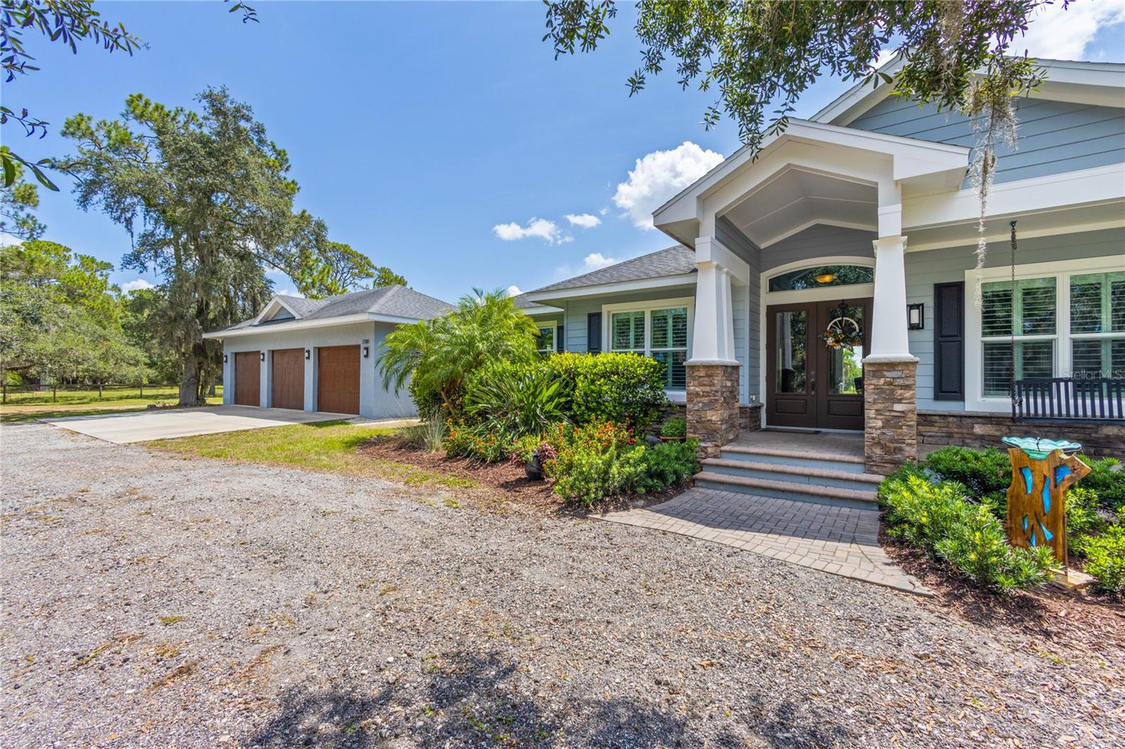 10 ACRES! Once in a lifetime opportunity: This incredible location includes a 3 bedroom, 3 1/2 bath home with huge bonus room, office/den, pool, spacious 3 car garage, Metal horse barn, A metal overhang with plenty of grazing space, oaks, pines
and a scenic pond all in the heart of Lakewood Ranch. No HOA, no deed restrictions or CDD fees. Located
between Fruitville and University off Lorraine Road just a gallop South of the Polo Fields. This property
gives you space, location and control. This custom masonry home was built by Jonas Yoder Construction
in 2014. The expansive primary suite boasts French doors opening to the pool/lanai, separate walk-in
closets with built-ins, a luxurious bath retreat with dual sinks, large walk-in shower with 2 separate
shower heads and a soaking tub. On the opposite side of the home, the guest suite has an ensuite bath,
providing privacy that is often missing for guests. The 3rd bedroom also has access to its own bathroom
and is tucked towards the back of the home offering added privacy. The home features high ceilings:
bedrooms 10' w/higher trays, great room & kitchen at 12' w/higher trays (up to 14'). Tray ceilings have
crown molding. Interior walls have sound-batting for noise reduction and custom plantation shutters
throughout. Work from home in the private office or enjoy movies/mingle in the bonus entertainment
room. The laundry/mudroom opens to the breezeway leading to the expansive 3 car garage, plenty of
space for toys or equip as the perfect workshop. Perfect for multigenerational living, the bonus room
could easily serve as a 4th bedroom. The kitchen is a chef’s delight complete with granite
counters, bar-top seating, glass tile backsplash, Sarasota Cabinetry featuring soft-closure, multiple pullouts and ample storage. The breakfast nook is located off the kitchen’s East end, formal dining room is
just off the West end. The kitchen also provides direct access and sight lines to the Great Room which
opens to the covered lanai via fully pocketed sliders. The lanai offers a built-in grill, sink and refrigerator
with access to the heated saltwater pool/spa. The home has luxury vinyl plank in common areas, PGT
impact windows and doors plus a standby generator with 250-gallon propane tank for backup power.
The electric is 300 amps pulled to the house with 100 amps going to the 3-car garage, which could be
used for a future addition, adding power for an electric vehicle or to provide for other future power
needs. The Barn is is a 2017 56x36 metal barn certified for 150mph winds. It is currently configured with four 12x12 stalls, 12’ center aisle, 12x24 feed/tack and equipment room and could be reconfigured multiple ways or repurposed as a workshop. The
10 acres may possibly be split for a 2nd residence. All 10 acres are fully fenced
with no-climb horse fence and cross-fenced offering multiple pastures for turnout and rotation. Convenient to I75, Benderson Park, UTC, Lakewood Ranch, Siesta & Lido Beaches and downtown Sarasota. This is a must see if you are looking for privacy on
10 ACRES OF LAND in town!