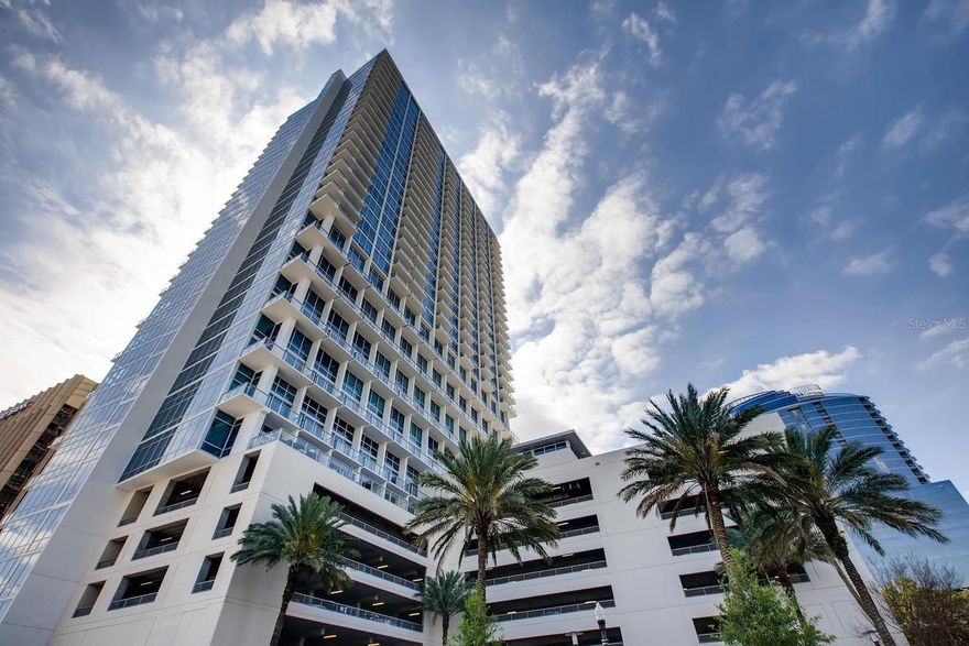 Experience elevated living in this luxurious 3-bedroom, 3-bath residence at The Vue at Lake Eola, showcasing breathtaking panoramic views of the Downtown Orlando skyline, Lake Eola, and glowing sunsets through 10-foot floor-to-ceiling wraparound windows.

Completely renovated in 2025, this modern masterpiece offers a seamless blend of sophistication and comfort with two private balconies, perfect for entertaining or relaxing above the city. The open-concept living area features sleek designer finishes, premium flooring, and a gourmet kitchen with high-end appliances and custom cabinetry.

Enjoy two premium parking spaces and access to state-of-the-art amenities, including a 5,000-square-foot fitness center, 24-hour concierge, valet parking, resort-style pool, media room, and exclusive resident lounge.

Nestled in the heart of Downtown Orlando, this residence offers the ultimate urban lifestyle—steps from fine dining, cultural venues, and Lake Eola’s scenic park trails.

Highlights:
3 Bedrooms | 3 Bathrooms | 2 Balconies
10-foot floor-to-ceiling glass walls
Fully renovated in 2025
2 Premium parking spaces
Downtown & Lake Eola views
Luxury amenities: gym, pool, valet, concierge