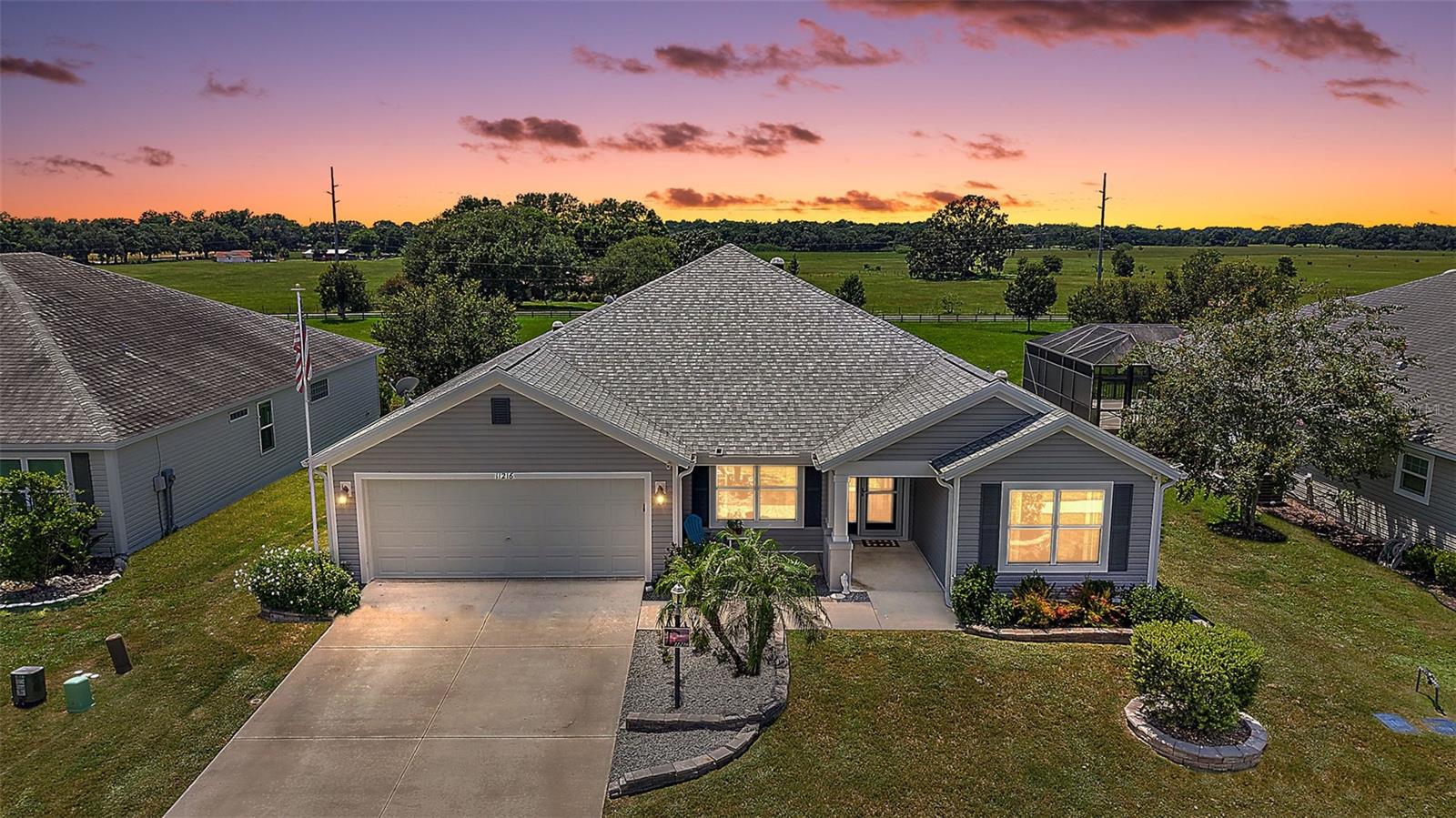 FABULOUS 4/2 Putnam Model with POOL on a PRIVATE, FENCED LOT overlooking a PRESERVE in the in the highly desirable, family-friendly, non-age-restricted, GATED community of Oxford Oaks! JUST MINUTES from The Villages retirement community, The Villages Charter Schools, and CR466 offering easy access to a plethora of shopping, dining, banking, medical and more! Tropical landscaping with curved TIERED walls and a charming FRONT PORCH welcome you in to the GENEROUS foyer of this BEAUTIFUL home! HIGH VAULTED ceilings and TILE flooring grace the VOLUMINOUS living, dining and kitchen areas. The OPEN-CONCEPT floor plan offers a SPACIOUS layout that connects these rooms for effortless entertaining and everyday living. From the living room, FRENCH DOORS open to the FABULOUS OUTDOOR OASIS of the lanai and POOL area overlooking PEACEFUL PRESERVE VIEWS! ENJOY your own PRIVATE HAVEN as you SWIM in the refreshing POOL; soak up the sun on the SPACIOUS deck; ENTERTAIN friends and family; or simply RELAX with your morning coffee, evening cocktail, or a good book! Doors at either end of the POOL area invite you to step outside to the PRIVATE, FENCED, REAR YARD – perfect for children and/or pets. Back Inside, the STUNNING GOURMET kitchen boasts GORGEOUS EBONY cabinetry, NEUTRAL countertops, STAINLESS appliances, EAT-IN breakfast bar, built-in PANTRY, and a SOLAR TUBE. Retreat to the primary bedroom boasting LUXURY VINYL PLANK flooring, TRAY ceiling, and a WALK-IN closet. It’s en-suite bathroom features EBONY cabinetry, NEUTRAL countertops, DOUBLE sinks, TILED ROMAN-STYLE WALK-IN shower, SEPARATE water closet, and a LINEN closet. A SPLIT floor plan, offers two additional bedrooms and a second bathroom conveniently hidden behind a POCKET DOOR near the front of the home, creating a PRIVATE guest wing. Bedrooms two and three each feature LUXURY VINYL PLANK flooring and built-in closets. The second bathroom is well-appointed with an EBONY vanity with NEUTRAL top, SOLAR TUBE, and a TILED tub and shower combination. There’s also a fourth bedroom with LUXURY VINYL PLANK floors and a built-in closet across the foyer. The INTERIOR LAUNDRY is centrally located just off of the kitchen and features EBONY cabinetry with NEUTRAL countertops, shelving, and a utility sink. Completing the package is a 22’x28’ two-car garage with PLENTY of room for parking and EXTRA STORAGE! With so much to offer, THIS HOME IS A MUST SEE! The Oxford Oaks Community offers INCREDIBLE AMENITIES including: a Resort Style Swimming Pool; Pickle Ball, Tennis, and Basketball Courts; Outdoor Exercise Equipment; and a wonderful Children’s Playground! All for a LOW HOA payment of $55/month with NO ADDITIONAL FEES or BONDS! Conveniently located near the intersection of 466 and 301, Oxford Oaks is JUST MINUTES from The Villages retirement community, The Villages Charter Schools, and CR466 offering abundant shopping, dining, banking, medical, and more! DON’T MISS YOUR OPPORTUNITY TO MAKE THIS FANTASTIC POOL HOME IN AN AMAZING LOCATION YOUR OWN! Please watch our walkthrough video and call today to schedule your Private Showing or Virtual Tour!