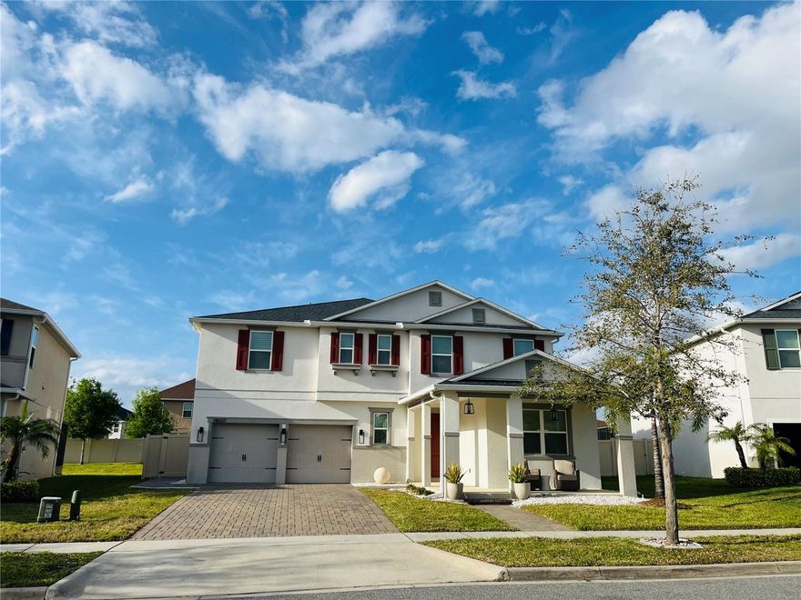 This beautiful 3,793 sq. ft. home in Orchard Park offers 5 bedrooms and 4.5 bathrooms, including a guest bedroom with an ensuite bath downstairs. The home features plantation shutters throughout, luxury vinyl flooring, new appliances, and freshly painted interiors. No carpet at all! The open kitchen, with granite countertops, oversized island, and walk-in pantry, is perfect for preparing meals and gathering with loved ones. Upstairs, the owners suite offers a huge walk-in closet and a luxurious bath. Two generously sized bedrooms with walk-in closets share a bathroom with double sinks, while another bedroom has its own ensuite bath. A spacious second-floor loft and laundry room with sink and cabinets complete the upper level, offering plenty of room for all of your needs. The outdoor space is just as inviting, with a completely fenced-in backyard, covered porch, and rear patio ideal for enjoying the Florida sunshine and relaxing in privacy. Located near Winter Garden Village and zoned for Keenes Pointe Elementary, Bridgewater Middle, and Windermere High School. Lawn care is included in the rent.