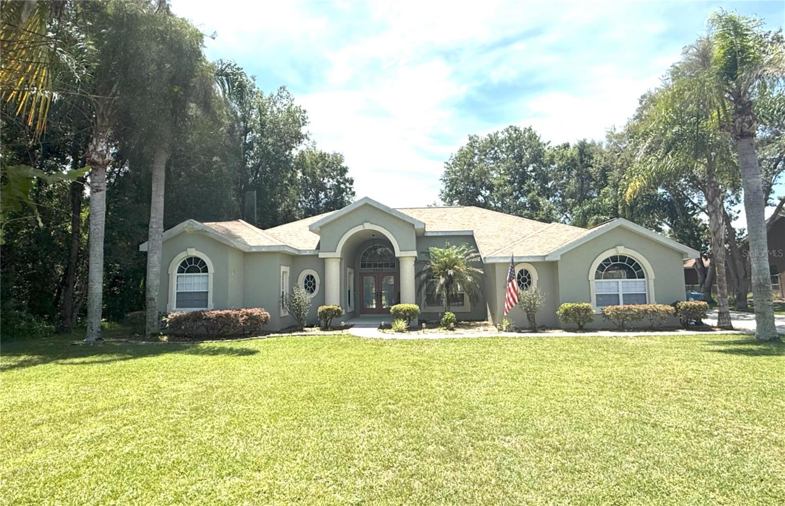 Come check out this IMMACULATE Cayman Built Home in the desirable River Country Estates! This 3 bed, 2 bath plus office, 2,430 sq. ft. saltwater pool home is nestled in a little over half an acre of peace, quiet and beauty. This home is one of the newer modern homes in River Country Estates, from the Colonial style columns at the front porch to the corian countertops, stainless steel appliances, formal dining and living rooms, family room and eat in kitchen, his and hers master closets and walk in closets for 2nd and 3rd bedrooms, jetted jacuzzi tub, 3 car garage, deep well water for sprinklers (front and back) providing a gorgeous lawn all year round with mature trees providing shade and lush landscaping. This gorgeous home also offers a "caretaker" filter system in pool and a water softener and purifier. Owners have taken AMAZING care of this home adding improvements such as an upgraded 5 ton Trane air conditioner, 50 gallon hot water heater, salt water system in pool, new wood floors and carpet (in bedrooms), exterior paint, pool lanai screen and new tracks and rollers for sliding glass doors that open up wall to wall to pool on two sides. Someone is getting a gem with this one! DON'T MISS OUT!