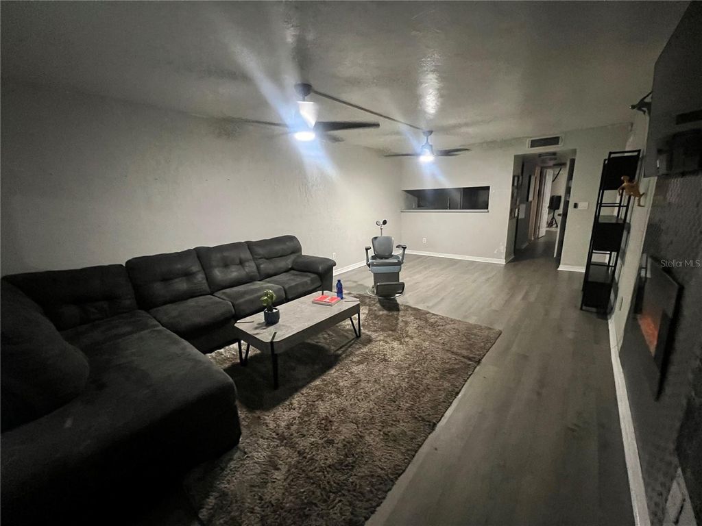 Photo of 3595 Whispering Oaks Lane #57, Palm Harbor, FL 34684 (MLS # TB8479222)