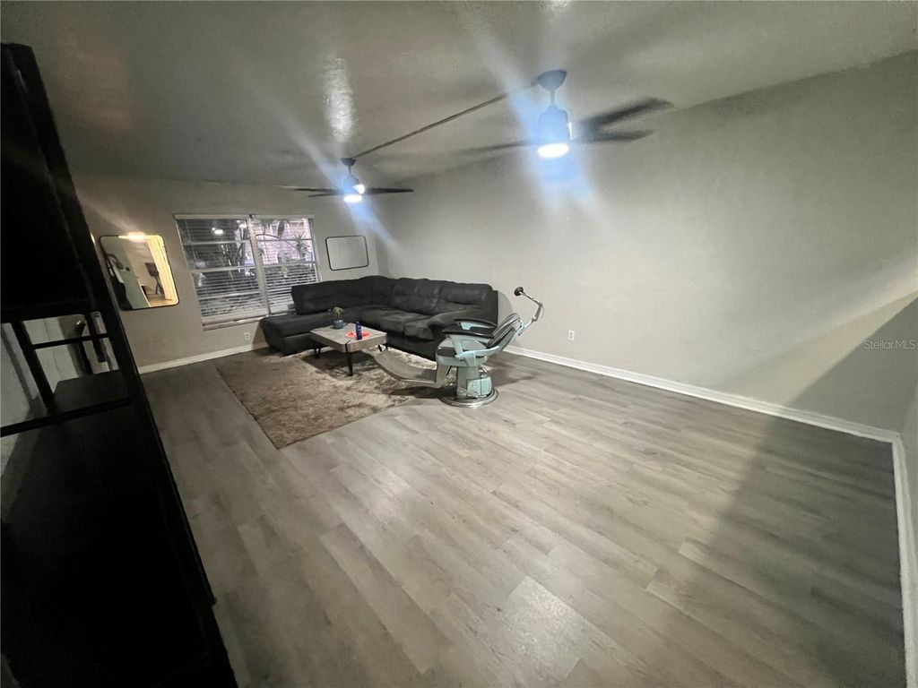 Photo of 3595 Whispering Oaks Lane #57, Palm Harbor, FL 34684 (MLS # TB8479222)