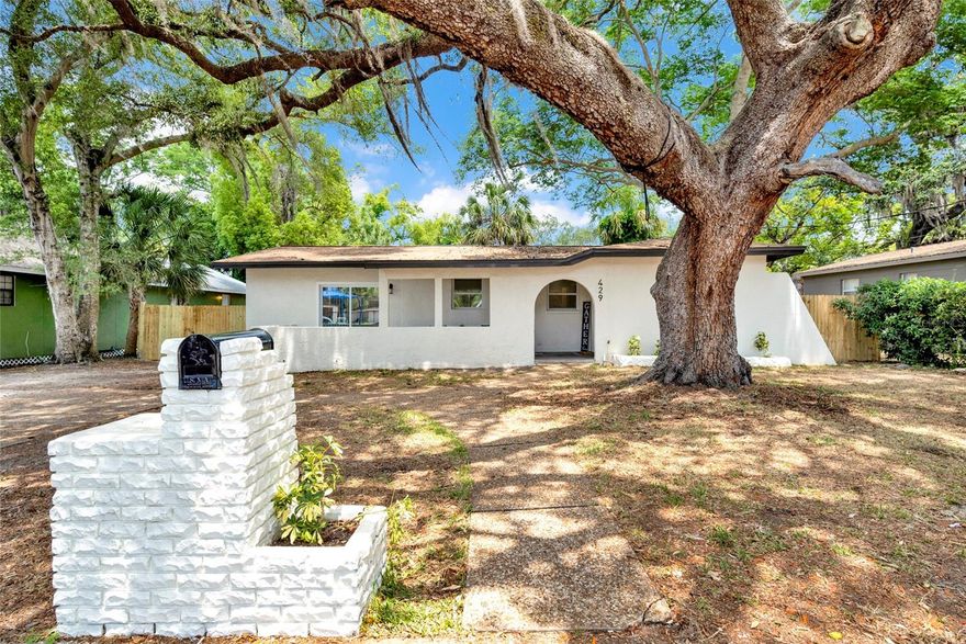 Welcome to this beautifully renovated 3-bedroom, 2-bathroom home offering modern style and comfortable living. This light-filled residence features an open floor plan with vinyl flooring, updated windows, and fresh contemporary finishes throughout. The kitchen boasts quartz countertops, stainless steel appliances, and custom cabinetry, flowing seamlessly into the dining and living areas. This home is perfect for everyday living and entertaining. The spacious primary suite includes a stylish en-suite bath with a walk-in shower, while two additional bedrooms share a fully updated bathroom. Enjoy peace of mind with upgraded systems throughout and your own private backyard oasis, complete with brand-new privacy fencing ideal for relaxing or hosting gatherings. Conveniently located 5 minutes from Downtown Tarpon Springs, easy access to shopping, dining, local activities and the famous Tarpon Springs Sponge Docks, this home has everything you need. Whether you’re looking for your forever home or your next investment, don’t miss out on this exceptional opportunity!
