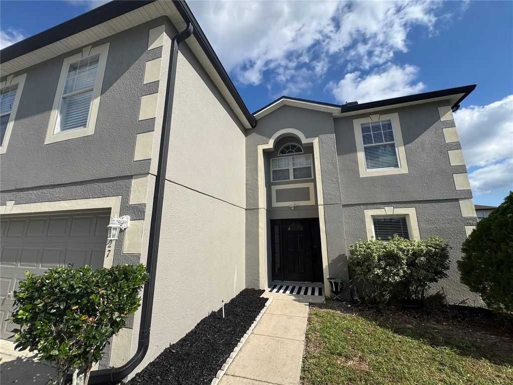 Photo of 627 Woodland Creek Boulevard, Kissimmee, FL 34744 (MLS # S5138644)