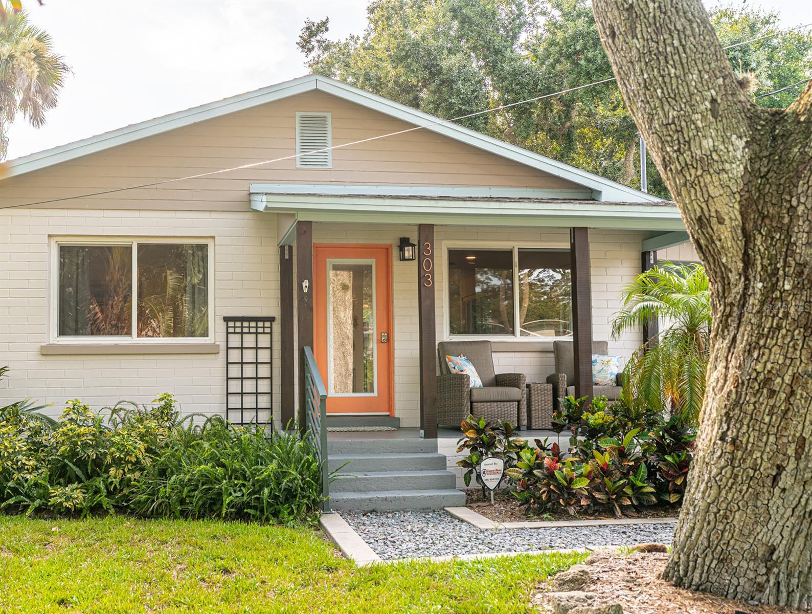 Welcome to your slice of paradise in the heart of Central Beach, one of New Smyrna Beach’s most coveted neighborhoods! This charming 2-bedroom, 2-bathroom single-family home offers the perfect blend of location, luxury, and laid-back coastal living.  Located only 3 blocks from the beach, steps from the vibrant shops and dining on Flagler Avenue, and a short stroll to the historic Coronado Mainland Shuffleboard Club, this home puts you in the center of it all.
Step inside to discover a beautifully updated kitchen featuring elegant marble countertops, modern appliances, and a light, airy design perfect for entertaining. Both bathrooms have been meticulously remodeled with high-end tile, and the main bath boasts a stunning custom glass shower enclosure. While the home is easy to maintain at 950 square feet, it is thoughtfully designed with an open floor plan for active living and entertaining, with plenty of storage space in one of its two sheds, and large attic.
The living spaces flow seamlessly to a spacious back deck, ideal for al fresco dining or enjoying the ocean breeze. The fenced-in backyard is a lush tropical oasis, offering privacy and serenity with mature palms and tropical landscaping. Â
Out front, a covered porch, two vibrant hibiscus bushes and fresh, tropical greenery enhance the home’s charming curb appeal. There is also a high-tech security system with multiple outdoor cameras for added piece of mind.
Enjoy walkability to beloved local favorites like 3rd Wave Café, Ciao Bella, D’Amore, The Garlic, and Norwood’s—all within minutes of your front door.
Highlights:
Recently Renovated Kitchen & Baths,
Marble Countertops & Modern Appliances,
6-Foot Custom Glass Shower Enclosure, heated towel bar, LED mirror and Bluetooth exhaust fan in main bathroom,
Rainfall and Handheld Showerheads in both baths,
Spacious Deck + Fully Fenced Tropical Backyard with secure gate to park,
Generous Storage Options,
New Landscaping with Tropical Plantings, Hibiscus and Palm Tree Accents,
Walk to Beach, Shops, Flagler Ave Restaurants, and Local Favorites, and
High-Tech Security System with Outdoor Cameras.
Don’t miss this rare opportunity to own a move-in ready home in one of New Smyrna Beach’s most desirable locations. Whether you’re looking for a full-time residence, vacation home, or investment property, 303 S. Pine St offers it all.
Schedule your private tour today and experience Central Beach living at its finest!