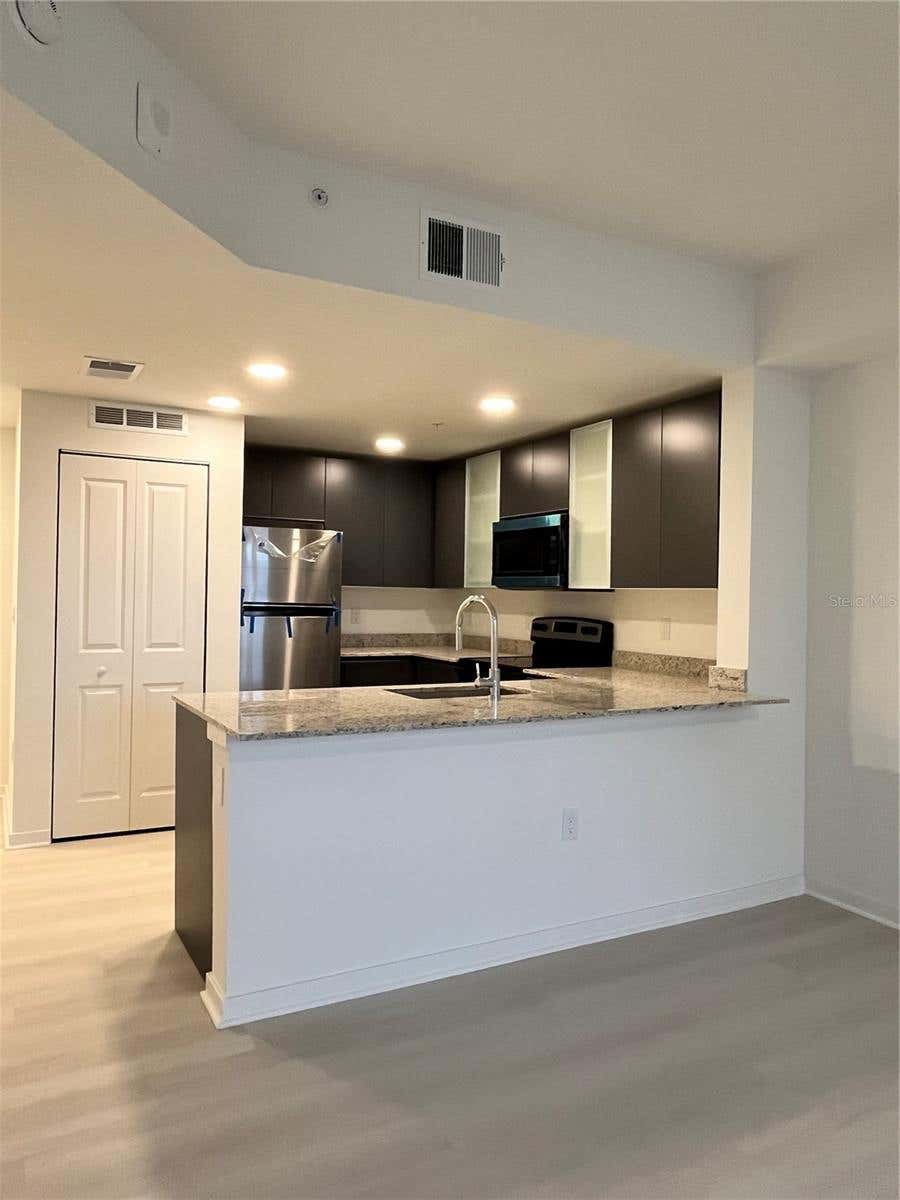 Photo of 5563 Millenia Park Blvd #209, Orlando, FL 32839 (MLS # O6436107)