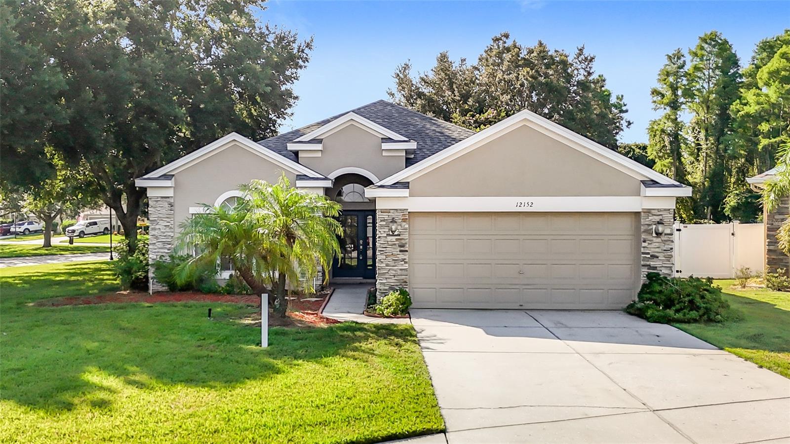 Former Builder’s Model – Upgraded & Move-In Ready! 3BR/2BA/2CG home with private pool on a large corner conservation lot on a cul-de-sac in gated Verandahs. Major updates: brand-new roof (July 2025), new HVAC (2025), fresh paint, new sprinkler heads, and lush sod/landscaping (2021). Features 42” cabinets, solid-surface counters, upgraded stainless appliances, hardwood and slate flooring, plantation shutters, and surround sound. Spacious primary suite and ensuite bath with garden tub, walk-in shower & walk-in closet. Separate formal dining room and flex room which is ideal for an office or playroom. Screen-covered lanai and pool with waterfall. NO FLOOD INSURANCE and LOW $55/mo HOA! Minutes to Publix, Veterans Expressway, Tampa Airport & beaches!
