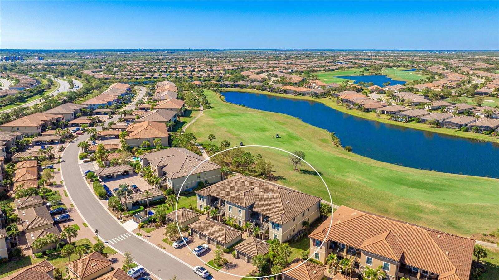 Enjoy the ultimate golf and resort lifestyle in this first-floor, end-unit condo with stunning lake and golf course views in the highly sought-after Esplanade Golf & Country Club at Lakewood Ranch. Unlike other units in the community, this condo is deeded with a FULL GOLF MEMBERSHIP—an exclusive benefit. This perk grants you unlimited access to the championship 18-hole golf course, professional instruction, and a full-service pro shop, offering an exceptional experience for golf enthusiasts. Inside, this 2-bedroom, 2-bathroom condo with a versatile flex space boasts an open-concept layout, high ceilings, crown molding, and an abundance of natural light, creating a bright and airy ambiance. The kitchen showcases 42-inch cabinetry, gleaming granite countertops, a pantry, and premium GE stainless steel appliances. The open concept floor plan flows seamlessly into the living and dining areas, where expansive sliders frame golf course and lake views, setting the perfect scene for relaxation and entertaining. Step outside to your screened-in lanai and take in the serene surroundings—an ideal spot to start your morning with coffee or unwind in the evening while enjoying breathtaking sunset views over the fairways. The primary suite offers two closets and an ensuite bathroom with dual sinks and a spacious walk-in shower. A one-car garage, located just steps from your front door, provides added convenience and security. Located just a stone’s throw from one of the community’s many pools, this condo provides easy access to Esplanade’s world-class amenities. Residents enjoy two grand clubhouses serving as the heart of social and leisure activities, as well as resort-style pools, a luxurious spa, and casual dining at the Tiki Bar. Stay active with tennis, bocce ball, a resistance pool, and a full fitness center, or explore the outdoors with the canoe and kayak launch, adventure playground, and barbecue areas. For dining and entertainment, Esplanade offers on-site options including the Barrel House Bistro, Bahama Bar, and Pizza Café. Beyond the gates, you are just minutes from Lakewood Ranch Main Street, Waterside Place, and the UTC area, where you’ll find upscale shopping, dining, and entertainment. **THIS PROPERTY QUALIFIES FOR A 1% LENDER INCENTIVE IF USING PREFERRED LENDER. INQUIRE FOR MORE DETAILS.**
