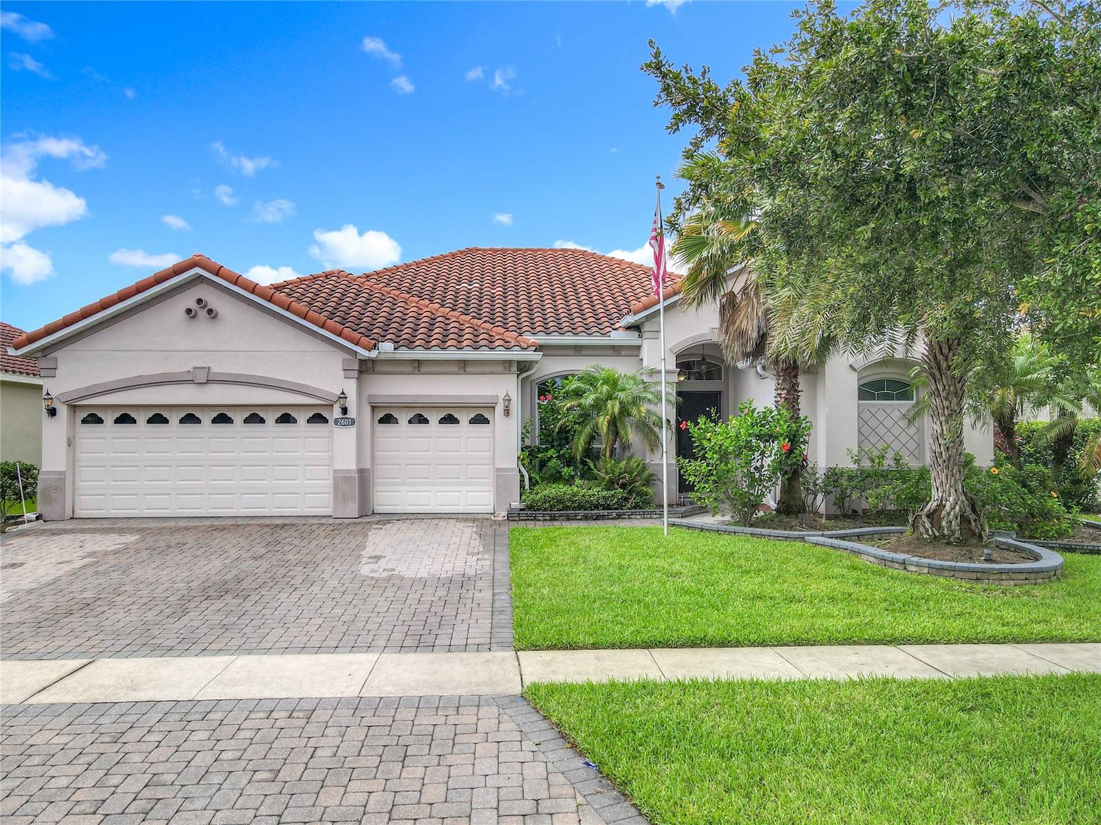 Welcome to the gated community of Avilla, where this stunning 4-bedroom, 3-bathroom pond-front residence offers resort-style living and timeless design. Built in 2013, this move-in ready home boasts a spacious 3-car garage and features a heated, screened pool with spa, surrounded by lush tropical landscaping and a covered rear porch that offers scenic pond views from the backyard oasis—perfect for relaxation and entertaining. The home comes with a Durable 50-year tile roof and whole-house generator for peace of mind and has an - open-concept kitchen with granite countertops, solid wood cabinetry, center island, breakfast bar, and casual dining nook plus an elegant formal dining room for hosting guests. The home has a versatile layout with the fourth bedroom functioning beautifully as a home office, while the three en-suite bedrooms offer privacy and convenience. The three-car garage has ample space for vehicles, storage, or hobbies. Additional features include a 200-gallon propane tank, 8'interior doors, volume and tray ceilings, and plantation shutters. Don’t miss the opportunity to own this beautifully appointed retreat in one of the area's most desirable gated neighborhoods with minimal HOA fees. The seller is leaving the weather station, outdoor dining set, and the 4 kitchen barstools as a convenience for the new owner. Any other furniture pieces or items, in the photos, including the washer and dryer, do not convey. All kitchen appliances convey.