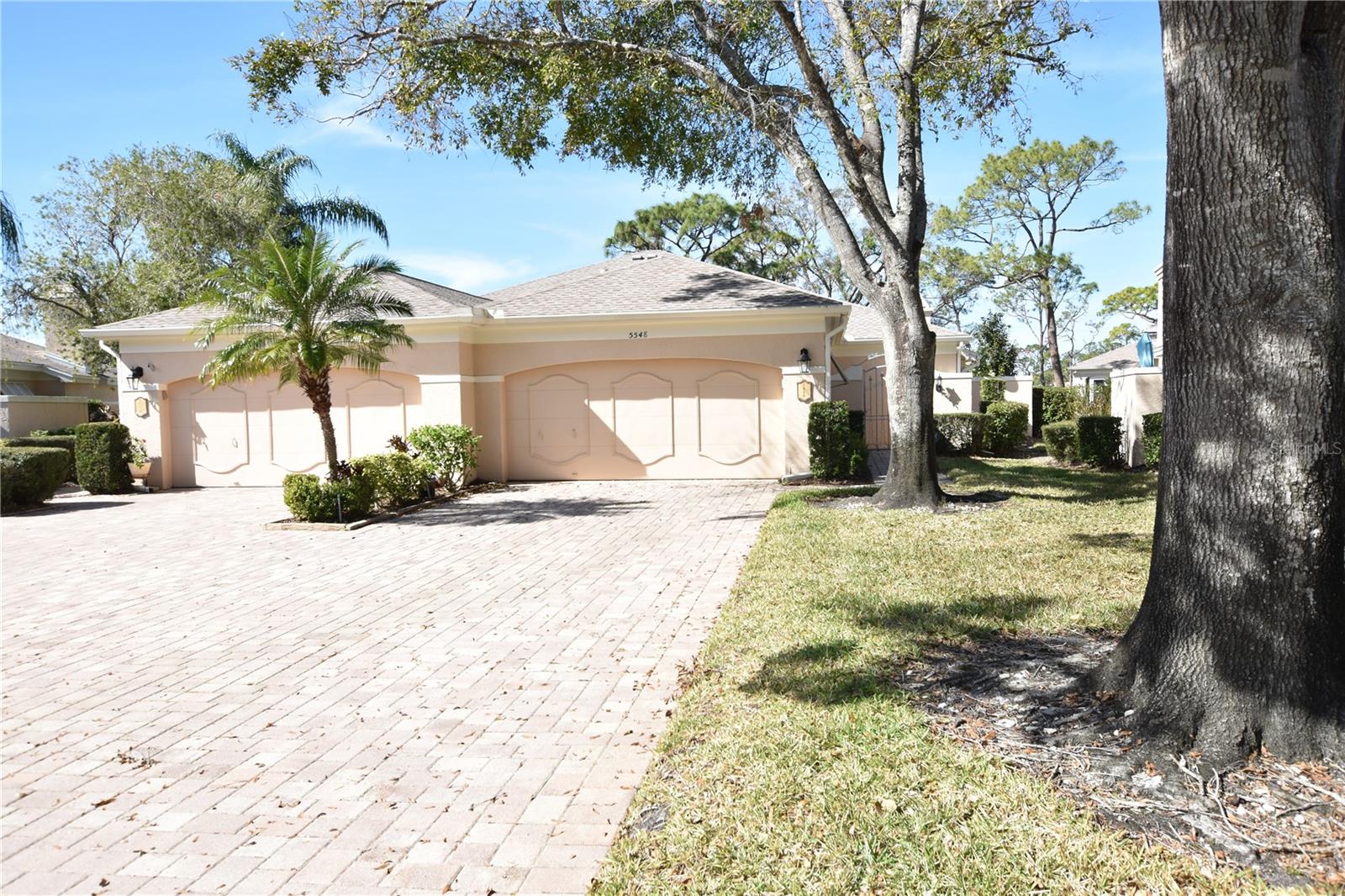 It's no secret The Meadows community stands apart from all the rest. This Chanteclaire 3 bedrm villa features the country kitchen model. Outstanding location on circle cul-de-sac at south end of the community. With stunning golf course views and close proximity to one of 2 pools in neighborhood it is one of prime locations. Spacious paver drive and 2 car attached garage provides more than enough room for both your vehicles and 4 guest vehicles. Inside previous owners had enclosed one end of lanai to provide room for office, art or craft space. This cold weather invites you to light up the fireplace and curl up with a good book. Fifty years ago, Lord Frank Taylor began to sculpt this community from wild ranch lands. Today this masterpiece, The Meadows, flows with open green space, sparkling lakes, old oak canopies, and is bejeweled with abundant wildlife and Florida ecology. It is a lifestyle, populated by a diverse resident background, and vibrant amenities, activities and social relationships. Since its beginnings The Meadows and its surroundings have continued improving and maturing. Now more than ever before it is incomparable. Residents enjoy 14 miles of biking and hiking trails, fun-filled activities, fitness center, Junior Olympic pool, pickleball courts, dining venues, and pay-to-play on a three 18-hole golf courses and top tennis complex Every dining, shopping, entertainment, and recreational opportunity is at your fingertips at the University Town Center and The Nathan Benderson Aquatic Park featuring a brand-new state of the art Mote Marine Seaquarium. You will not find another community with the same vibe, aesthetics, connections or conveniences, a good book, this summer the newer 2022 AC unit will keep you cool. The kitchen area is referred to as a country kitchen with extra space for eating, TV or whatever you might enjoy. Also conducive to the kitchen is an outdoor grilling patio.
