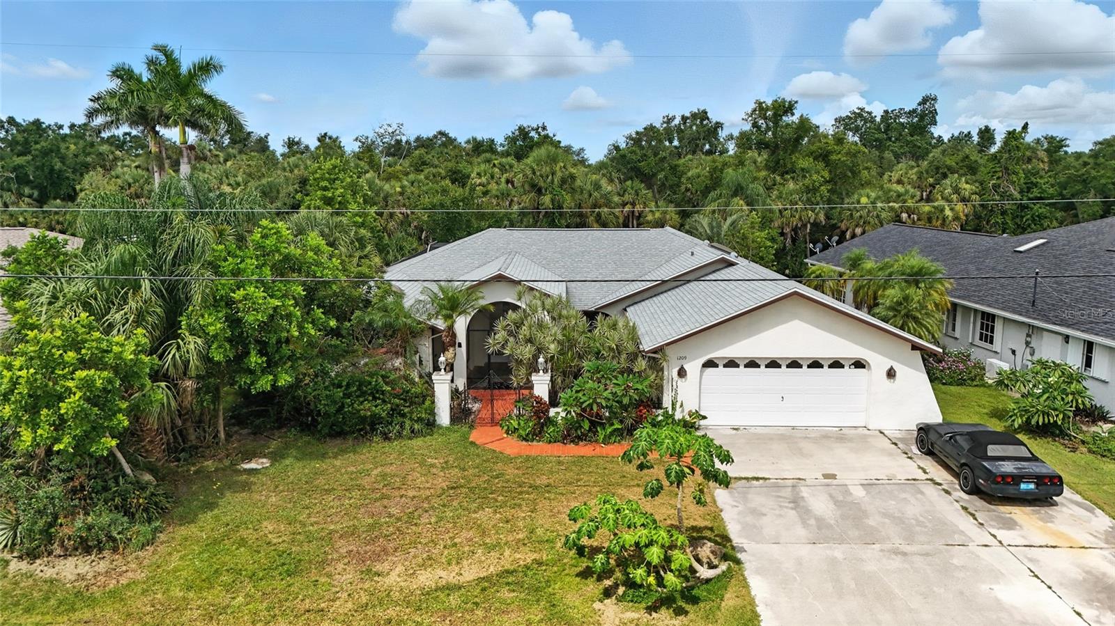 Beautiful Vintage Waterfront Courtyard Home with Pool and Lush Gardens
This custom-built 3-bedroom, 3-bath canal-front home is a rare gem with timeless charm and unique character. Originally the model home for renowned builder Del Costello in 1987, it showcases a host of upgrades and desirable amenities, perfectly designed for Florida outdoor living and entertaining.
Situated on a serene freshwater canal with a wood dock, the backyard is a private tropical oasis featuring mature landscaping, a koi pond, and garden-like settings that blend seamlessly with nature. Enjoy bird watching and tranquil water views right from your lanai.
Interior Features Include:
• Spacious master suite with en suite bath and direct double French door access to the lanai
• Formal living and dining rooms, with sliders and a double French door offering views of the pool and canal
• Large tiled foyer with double glass doors, screened and covered for a welcoming entry
• Elegant stained-glass windows in the formal dining area and family room
• Wet bar in the living area for entertaining
• Custom architectural touches throughout
Outdoor Living Highlights:
• In-ground pool surrounded by a large, screened lanai and lush landscaping
• third bath on the lanai for convenience
• Expansive covered area for dining and lounging
• Canal access for kayaking or relaxing by the water
Additional Features:
. New pool pump
• Recent air conditioning system upgrades
• Double-door iron gate entry with landscaped courtyard
• Great location close to schools, shopping, restaurants, and beaches
This property is a true showcase of Florida living—private, peaceful, and full of charm. Schedule your showing today to experience this unique waterfront retreat.