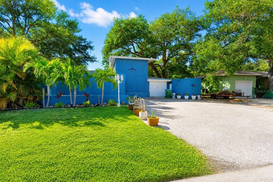 NO FLOOD ZONE YET 1 MILE FROM THE BEACH! Yes, you read that right! This unique and exquisite home has 4 bedrooms PLUS a bonus room that can be an office/den and a huge living rom, bar, dining room, family room and game room! What a perfect vacation rental or family home on this oversized lot with an awesome fenced backyard just past the new back deck, outdoor shower and tropical flowers in the sunset back here. It is also zoned redential P-1 which in Pinellas County allows for professional office space too! This is the best of Florida living, working from home and more. The location could not be more perfect as you can see it is tucked away yet just around the corner from all shopping, #1 beaches in the NATION, restaurants and highways to anywhere you want to be! Schedule your private showing today!
