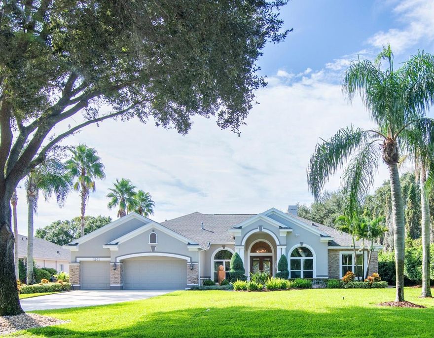 BACK ON THE MARKET!! SELLER MOTIVATED - Whether you like to fish, boat or just relax this beautiful home is a must see.  Located on a cul de sac in the exclusive quaint community of The Lakes of Wellington, this executive home has been thoroughly updated and meticulously maintained and the backyard is absolutely gorgeous!! The home features 4 bedrooms, 3.5 baths, large gourmet kitchen with walk-in pantry, formal living area with gas fireplace, an office, 3 car garage, screened in pool with extra large deck space, an outside gas firepit with gorgeous views from your private backyard oasis.  Starting from the time you enter through the custom stained glass double front doors, you will be treated to loads of upgrades and beautiful tile work throughout.  Home features Schonbek Crystal Chandeliers, upgraded landscaping, hurricane windows and garage doors, all bathrooms remodeled including large jetted tub in the master, outdoor water features, gorgeous views of Cool Kell Lake, outdoor landscape and up lighting, and much much more. Schedule your private showing today! 
New roof in 2019, new Acs in 2016 
Please see upgrade sheet for all the amazing upgrades and features this home has to offer!