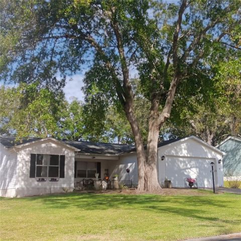 Photo of 719 Oak Lane, Lady Lake, FL 32159 (MLS # O6375906)