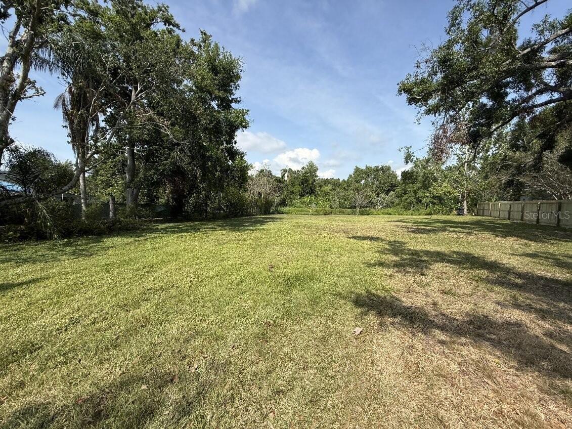 Rare find! Nearly half an acre vacant home lot on a quiet cul-de-sac and very close to all that Sarasota has tThere are extremely few ready to build lots in Sarasota, and this is central to everything (in the county but just outside of the city of Sarasota). The only vacant lot of the 8 properties in this mature, established, non-deed restricted neighborhood. There is no community association, so enjoy no HOA fees as well as the freedom to park your vehicles, boats or RVs on site. The lot is near lots of shopping, the newly renovated Bobby Jones golf course, and the Legacy Trail! Just a 2 mile drive to I-75, 4 mile drive to downtown Sarasota, 7 mile drive to either Lido Key Beach or the modern UTC mall, and a 10 mile drive to the #1-rated Siesta Key Beach! It is a .42 acre shady lot on a pond that includes land on the far side of the water too that could be bridged with a gazebo on the other side. We did conceptualize making the lot into our own slice of paradise (see the picture) but had a change in family plans. Choose your own dream home and bring your own builder. No utilities currently on the site, but the property can be connected to county water & electricity (requires septic tank installation). Serious purchase inquiries only.
