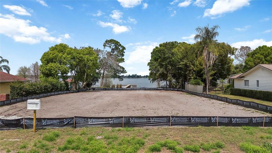Pre-Construction. To be built. A rare opportunity to secure a large lakefront homesite on South Lake Conway, offering access to the entire Conway Chain of Lakes, with a custom pre-construction home planned for the property. Positioned on a spacious lot in the beautiful and highly desirable community of Belle Isle, this homesite sits directly on Lake Conway and is located on a very quiet dead end street.

This custom pre-construction residence at 2815 Trentwood Blvd allows buyers to personalize finishes and selections while securing a premier lakefront setting with building permits and site preparations complete. Boasting over 4,800 square feet (4,200 in the main house, 600 above garage bonus space), this 5 bedroom, 4 bathroom home with a three-car garage is thoughtfully designed for both everyday living and elevated indoor and outdoor entertaining. 

The outdoor living space is a true highlight, featuring an expansive covered lanai and a fully equipped outdoor kitchen with gas grill and hood. A dramatic 12' x 8' rear sliding glass door creates a seamless indoor-outdoor connection, filling the home with natural light and allowing you to fully enjoy the lakefront setting. Whether hosting gatherings or enjoying quiet mornings overlooking the water, the design is centered around effortless Florida living.

Inside, the home offers open-concept living areas, a dedicated work-from-home space, and an oversized bonus room ideal for a media room, game room, or guest suite. Every space has been planned to offer flexibility for a variety of lifestyles.

Modern features include dual tankless water heaters, an optional whole-home generator panel, optional EV charging capability, optional landscape lighting, and 8-foot exterior doors throughout, all designed with Florida living and long-term durability in mind.

Optional HOA access includes a private community boat ramp, lakefront parking, and a picnic area, adding additional convenience for those looking to fully enjoy the Conway Chain of Lakes lifestyle.

Located just minutes from Orlando International Airport, Downtown Orlando, and the SODO District, this home also offers easy access to shopping, dining, and Central Florida’s world-renowned attractions including Walt Disney World. This location delivers both everyday convenience and long-term value.

This is more than a home, it is an opportunity to create your place on the Conway Chain of Lakes with a custom residence designed around the way you want to live.

Pre-construction opportunity. Renderings and plans available upon request.