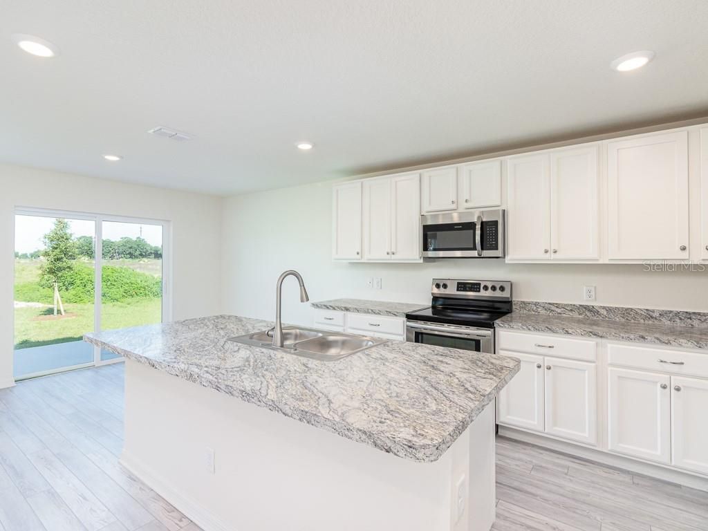 Photo of 3124 N Chamberlain Boulevard, North Port, FL 34286 (MLS # O6314852)