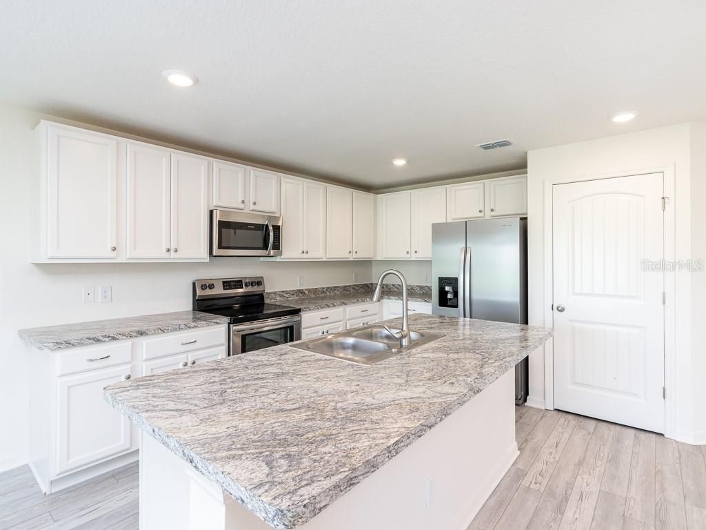 Photo of 3124 N Chamberlain Boulevard, North Port, FL 34286 (MLS # O6314852)