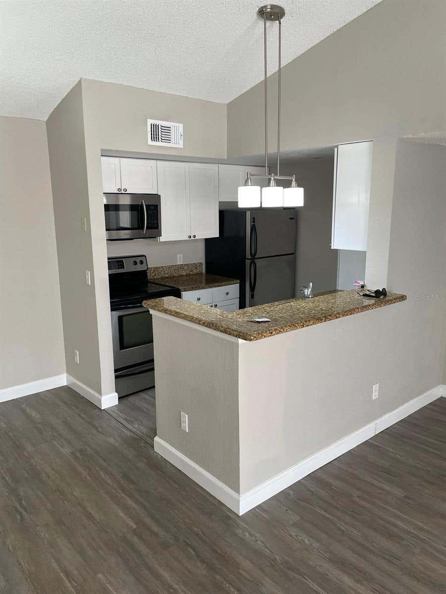 Photo of 5140 Conroy Road #35, Orlando, FL 32811 (MLS # O6429100)