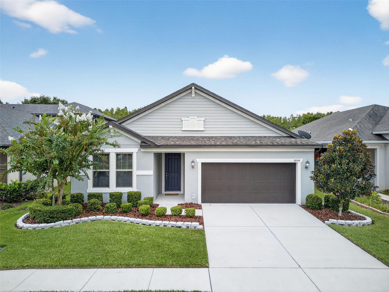 Welcome to 30514 Pecan Valley Loop, located in the heart of Wesley Chapel’s highly sought-after community of Country Walk!
This stunning Foxtail floor plan by Meritage Homes (built in 2017) offers the perfect blend of modern style, everyday comfort, and functional design. Pride of ownership radiates throughout this meticulously maintained single-story residence, making it truly move-in ready from day one.
Step inside and discover an inviting layout that boasts 4 spacious bedrooms, 3 full bathrooms, and a versatile flex room—ideal for a home office, playroom, or even a private media lounge. The open-concept living area was designed with entertaining in mind, featuring a bright and airy great room that flows seamlessly into the elegant dining area and chef-inspired kitchen.
The kitchen is a true highlight, showcasing gorgeous countertops, stainless steel appliances, timeless cabinetry, and a walk-in pantry—a perfect balance of beauty and practicality for any home cook or entertainer.
The thoughtful upgrades don’t stop inside. Step outside and embrace Florida living at its finest with the extended, fully screened lanai, perfect for morning coffee or evening gatherings. Your peaceful, fully fenced backyard backs up to private conservation views, providing a sense of both luxury and tranquility. The premium lot elevates the home’s appeal, making the outdoor space ideal for hosting friends, enjoying quiet family time, or just sitting to enjoy the view and fresh air.
Beyond the home itself, Country Walk is one of Wesley Chapel’s premier communities, offering residents a vibrant lifestyle with amenities that make every day feel special. With very low HOA fees that include high-speed Internet and cable, you’ll also enjoy access to neighborhood features like walking trails, community pools, sports courts, and more. The location can’t be beat—just minutes from top-rated schools, major interstates, shopping destinations, restaurants, and entertainment venues.
Don’t miss the opportunity to own this rare gem that truly checks every box. Schedule your private showing today and see for yourself why this Country Walk beauty won’t last long!