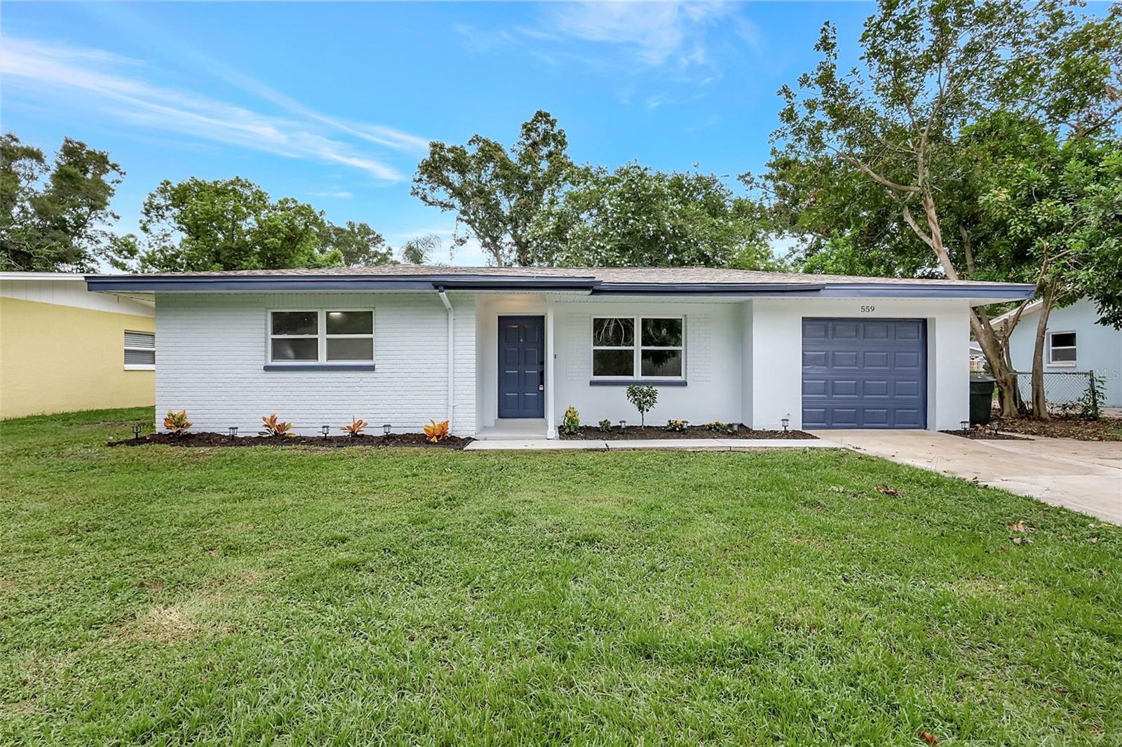Welcome to this Fully Renovated 3-bedroom, 2-bathroom home located in the highly sought-after Grove Acres community of Dunedin, Florida. With no HOA and sitting on a 0.18-acre fenced lot, this home offers modern updates, privacy, and charm in a prime location. From the moment you arrive, you'll be impressed by the attractive curb appeal and manicured landscaping that give this home a warm and inviting presence. Step inside to discover brand new luxury vinyl plank flooring that flows throughout the living spaces, adding a fresh and contemporary feel. The updated kitchen is both functional and stylish, featuring brand-new stainless steel appliances, quartz countertops, and sleek cabinetry. It's perfect for home chefs and entertainers alike. Each of the three bedrooms is bright and spacious, with large windows that fill the rooms with natural light. The primary suite features a beautifully updated bathroom with a modern vanity, a smart mirror, and a fully tiled walk-in shower, providing a spa-like experience. The living space extends seamlessly outdoors through a sliding glass door that leads to a screened-in patio. From there, enjoy views of the private backyard, ideal for hosting gatherings or enjoying a quiet evening as the sun sets. Additional features include a one-car garage and a fully fenced yard offering security and peace of mind. Located just minutes from vibrant downtown Dunedin, top-rated schools, parks, and the Gulf beaches, this move-in-ready pool home is a rare find in an established, no-HOA neighborhood.