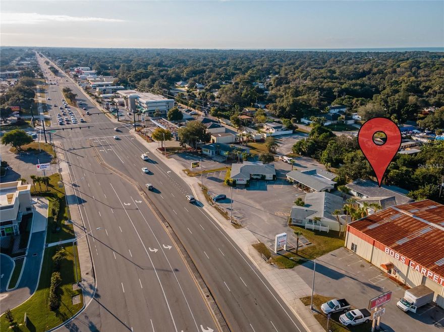Commercial space with frontage on US 41 in the heart of Venice. This building has two separate entrances that presents the possibility to divide it into two units. This building has so much potential providing several offices, a very large kitchen, dining area, laundry room, bathroom and a screened outdoor lanai area. There are over 40 parking spaces with 2 handicap spaces in front of and beside the building. This property has an excellent location directly across from Jacaranda Plaza with several restaurants and retail stores and is adjacent to residential neighborhoods.