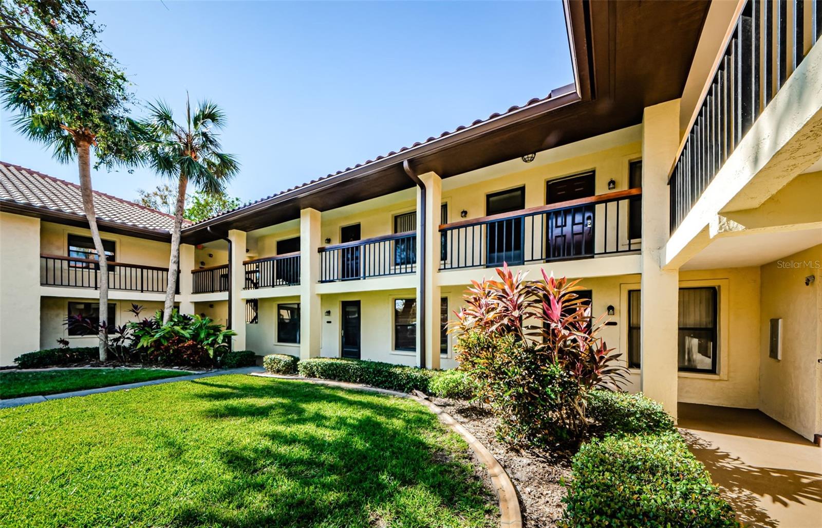 Gorgeous, furnished second floor condo with amazing pond view. Tucked back away from the hustle and bustle, you will find a gated community in north Clearwater with lovely grounds, community pool and spa, clubhouse, and pickleball/tennis courts. Enter this beautifully decorated and renovated condo that is available immediately and move in ready for a new occupant! Enjoy cooking in the remodeled kitchen that overlooks the spacious living and dining rooms. Half bath is perfect for guests. Large bedroom features a walk-in closet and en-suite bathroom which make for a perfect retreat overlooking the pond just outside the bedroom. Sip on morning coffee from the screened in patio where you can soak in the water and wildlife views. Inside laundry. Assigned parking spot is directly in front of the building for convenience. Centrally located to the Countryside Mall where you have a wide selection of eateries and shopping choices. Also, just a short drive to Tampa International Airport, golf, public libraries, local beaches including world-famous Clearwater Beach, as well as medical facililties and grocery stores. Just bring your personal belongings and you are home!