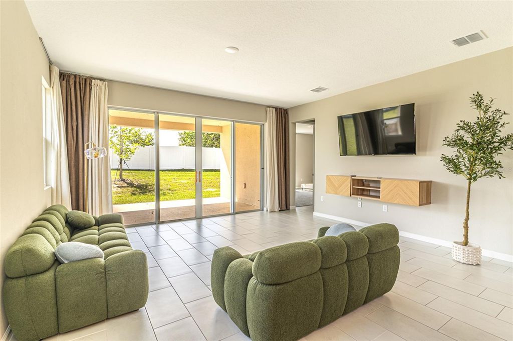 Photo of 148 Hilltop Bloom Loop, Haines City, FL 33844 (MLS # L4960976)