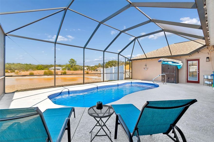 Florida PARADISE with land!! Experience modern luxury in this 2023-built masterpiece, perfectly situated on 1.2 pristine "high and dry" acres. This expansive 2,872 sq. ft. - heated, this residence offers 4 spacious bedrooms, 3 full bathrooms, and a massive 3-car garage. The open-concept interior features a designer kitchen equipped with a dedicated ice maker and sleek finishes, flowing seamlessly into the light-filled living area. Step outside to your private oasis: a pristine pool with a full enclosure overlooking peaceful pond views. Enjoy the ultimate freedom of no HOA or CDD fees while being minutes from the Suncoast Parkway for a swift commute to Tampa or Clearwater. A rare blend of privacy, space, and modern design—schedule your showing today! New Shed and Dog run!!
NO FLOOD REQUIRED!!  STRUCTURE IN An " X " ZONE!!