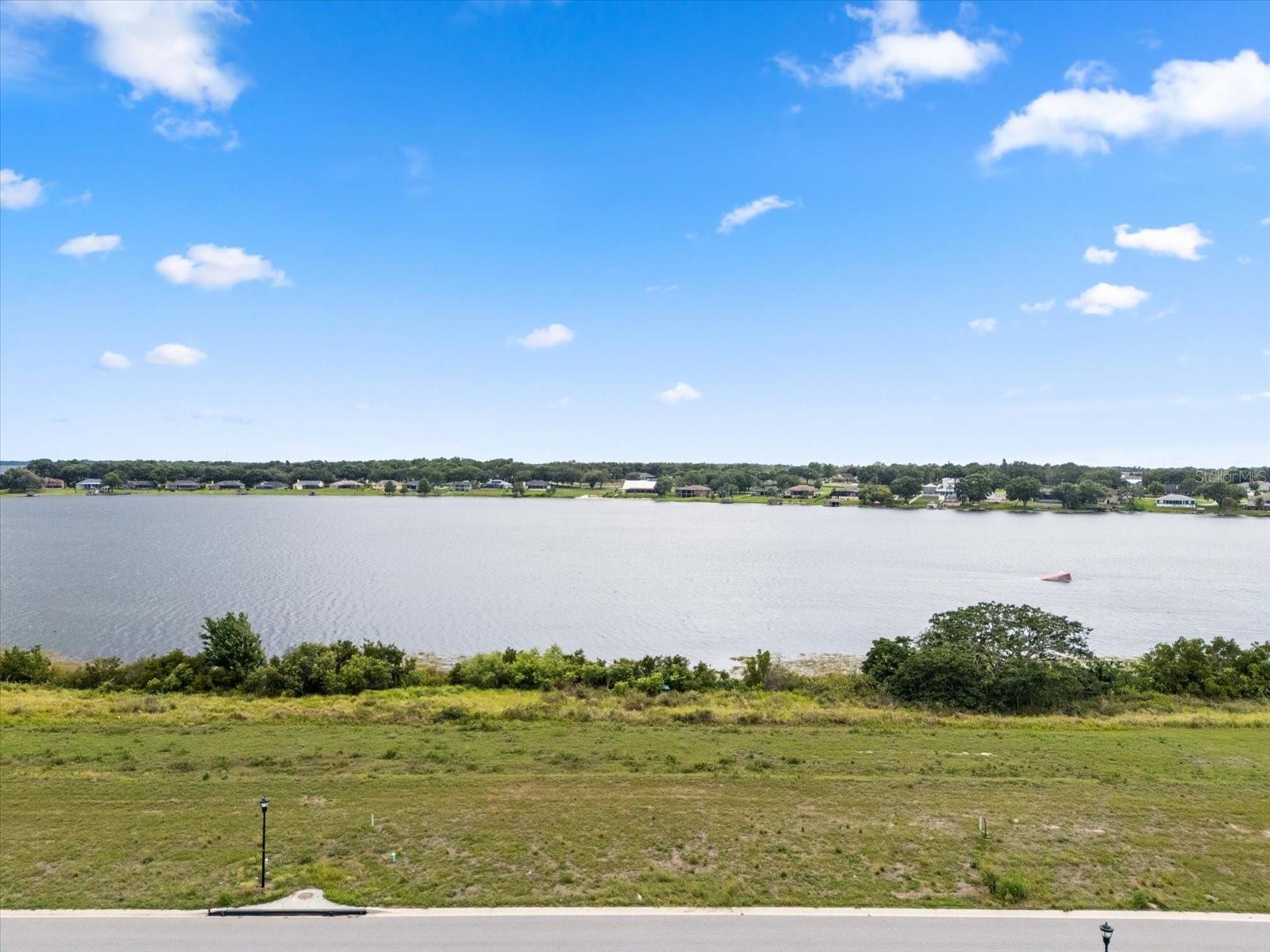 Build the home of your dreams on this exceptional lakefront lot offering direct shoreline on beautiful Lake Tennessee. Nestled within the prestigious, gated community of Lake Juliana Estates, this cleared lot is ready for your vision—offering panoramic water views and access to a serene 108-acre public lake ideal for boating, fishing, water skiing, and more. Residents of Lake Juliana Estates enjoy exclusive, resort-style amenities including a clubhouse, fitness center, tennis and pickleball courts, and a private community boat ramp to Lake Juliana. Conveniently located near I-4, this prime location provides easy access to both Orlando and Tampa. Don’t miss the chance to own a slice of lakefront paradise in one of Central Florida’s most desirable communities!