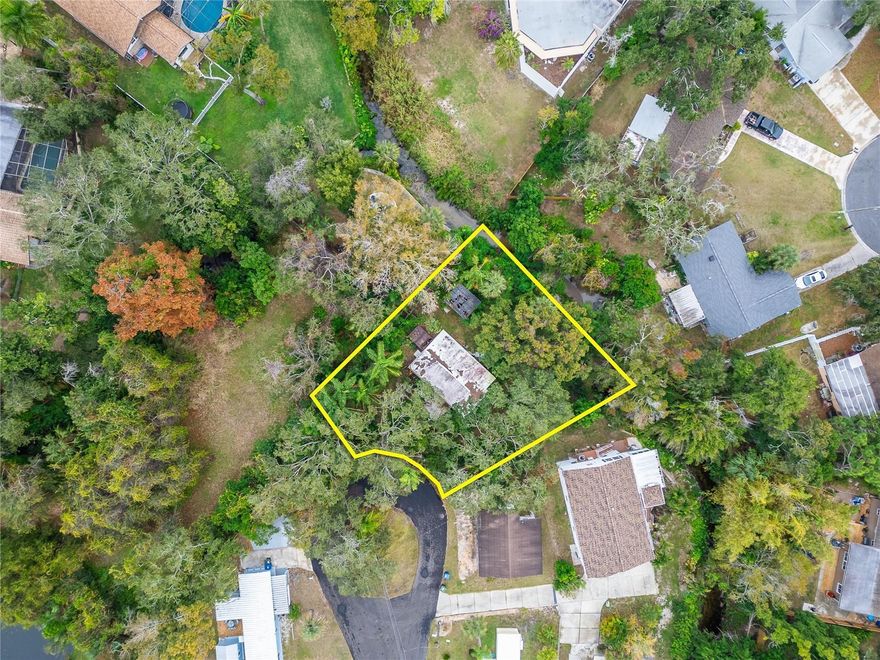 A great opportunity to own a spacious 11,252 sq ft lot in a highly desirable area of Largo. This property includes a condemned mobile home and is being sold for land value only. The structure on the property will be removed. Enjoy a private setting with mature surroundings while still being close to shopping, dining, beaches, and major roadways. Ideal for investors or buyers looking to build or place a new home in an established neighborhood. No value assigned to existing structure.