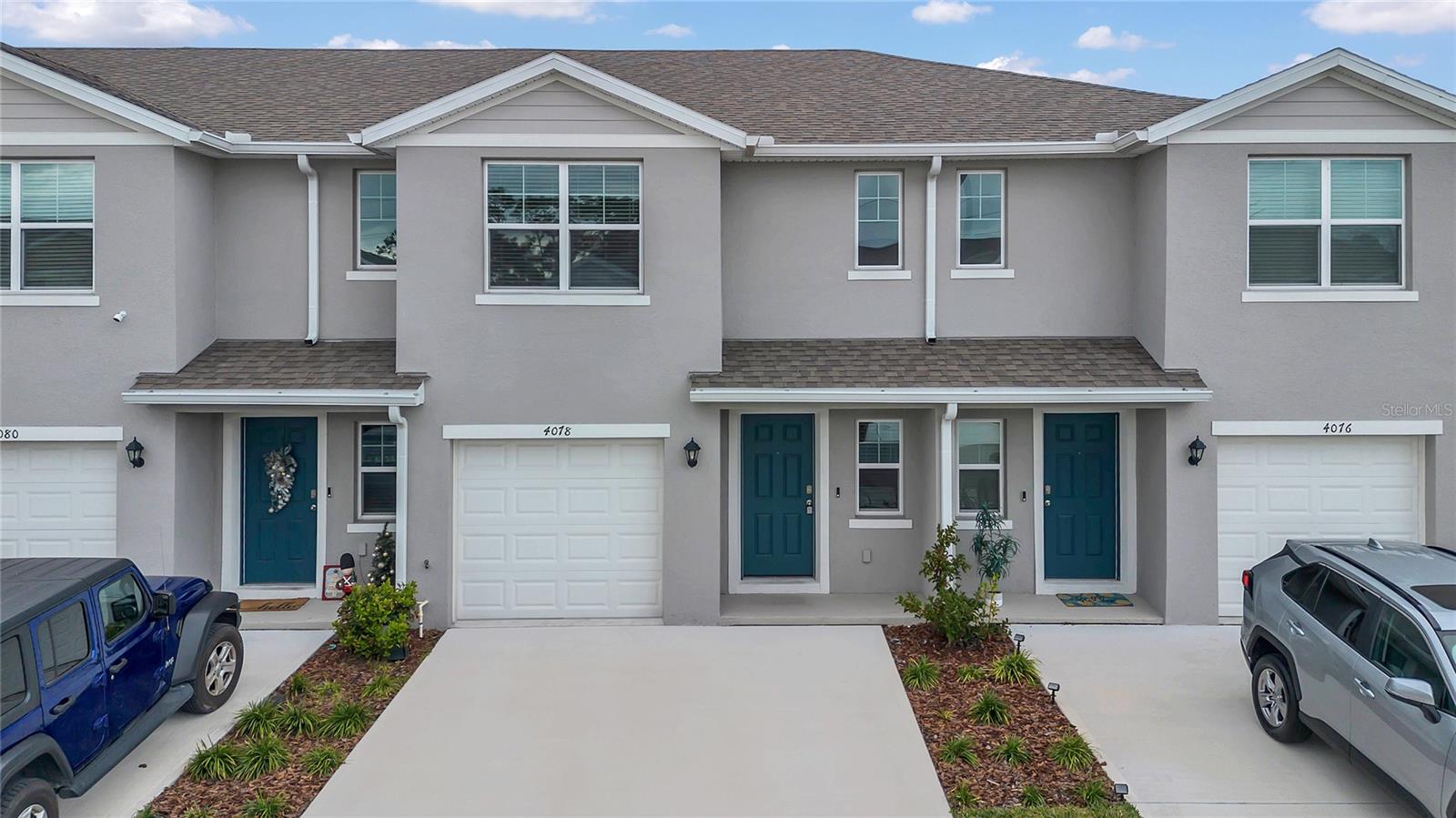 Welcome to Buena Lago and the Pearson townhome, where modern design meets comfortable living. This 3-bedroom, 2.5-bath home offers a spacious layout with stylish finishes, including modern luxury vinyl flooring throughout the first floor. The main level features a welcoming foyer, a powder room, and an open-concept living area that flows seamlessly into a kitchen equipped with stainless steel appliances, ample cabinetry, and an island with bar seating. The living room overlooks a patio, perfect for relaxing or entertaining. Upstairs, the primary suite includes a generous walk-in closet and an ensuite bathroom with a double vanity. Two additional bedrooms, a full bathroom, and a convenient laundry room complete the second floor. This home also includes a single-car garage and a Home is Connected smart technology package, allowing you to control key features from your smart device. Located in the growing Buena Lago community of St. Cloud, you’ll enjoy easy access to Orlando, Disney, Lake Nona, and the coast, as well as amenities like a pool, playground, and green spaces.