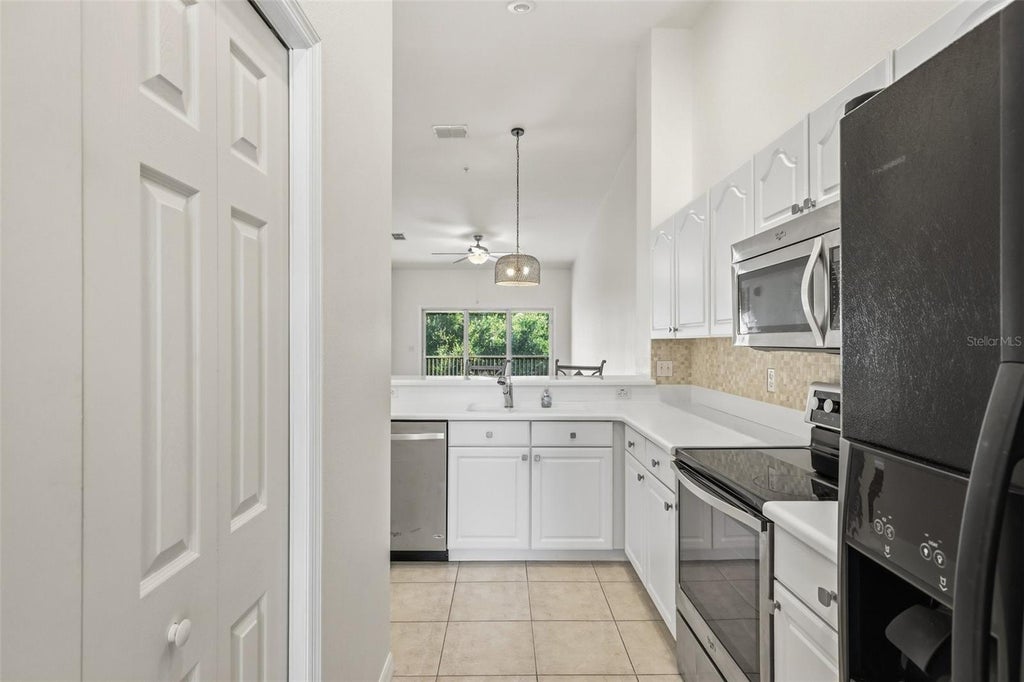 Photo of 200 Canopy Walk Lane #243, Palm Coast, FL 32137 (MLS # FC321170)