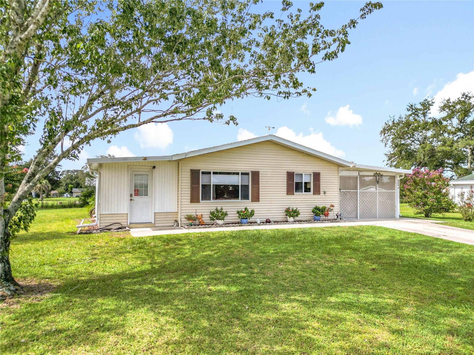 Well-maintained 2-bedroom, 2-bath home in the desirable 55+ community of Spruce Creek North. This move-in ready home offers 1,095 sq ft of comfortable living space on a ¼-acre lot and features major updates, including a 2022 roof and Lennox HVAC system. Inside, you’ll find luxury vinyl and tile flooring, custom cellular shades, and a spacious kitchen that opens to the living area. Enjoy the 8x14 Florida room or relax on the 11x23 covered and screened porch overlooking the backyard. Additional highlights include an indoor laundry area, extra storage, and a leaf guard gutter system for easy maintenance. Community amenities include a pool, clubhouse, tennis courts, racquetball, and fitness center—all just a short stroll away. Conveniently located near shopping, dining, and medical facilities. Schedule your private showing today and see why this home is a perfect blend of comfort, convenience, and community living!