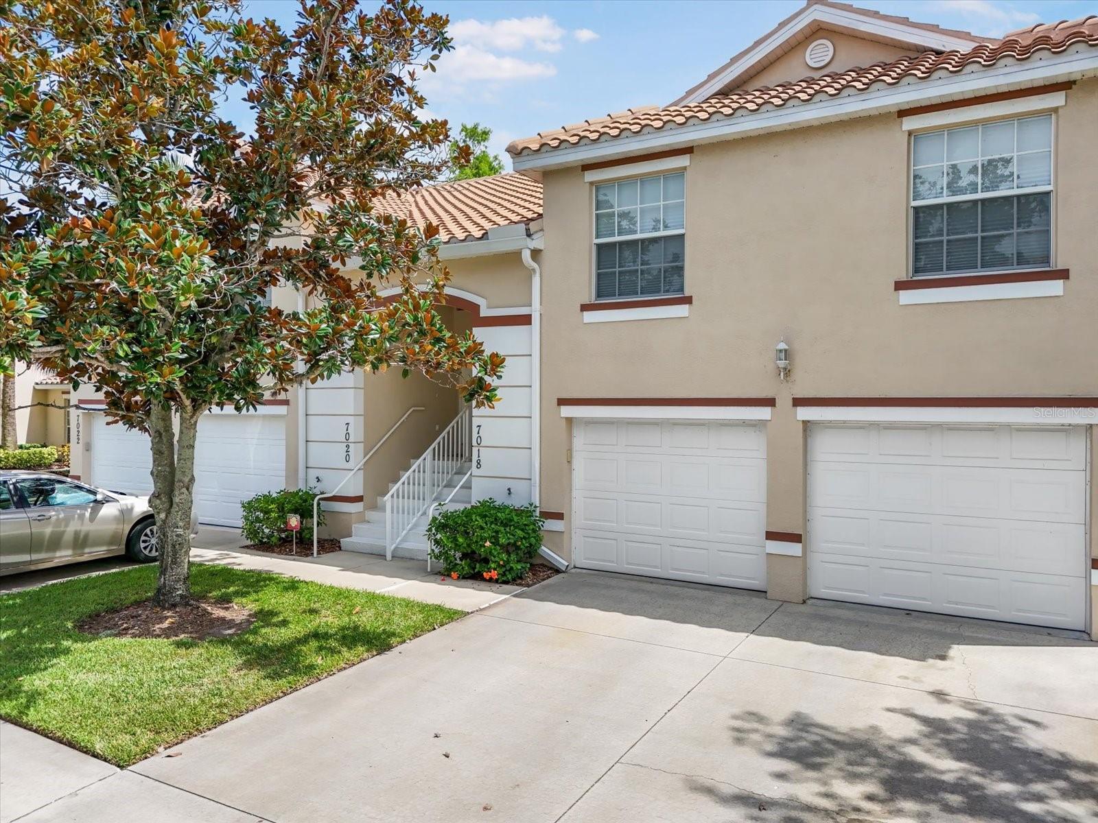 Welcome to 7018 Scrub Jay Way, a bright and inviting 2-bedroom, 2-bath condo with an attached 1-car garage, located in the highly desirable gated community of Cypress Strand at Tara Preserve. This upstairs unit offers a spacious, open floor plan with vaulted ceilings and oversized windows that fill the space with natural light. The kitchen features abundant cabinetry, breakfast bar seating, and a seamless flow into the living and dining areas—perfect for entertaining or relaxing at home.
Enjoy peaceful views from your private screened lanai overlooking the tranquil pond and beautifully landscaped grounds. The split bedroom layout provides added privacy, with a spacious primary suite offering an en-suite bath and large walk-in closet. A second bedroom and full bath are ideal for guests or a home office setup.
Cypress Strand residents enjoy access to a community pool, tennis courts, and maintenance-free living. This quiet, well-kept neighborhood is ideally situated near Tara Golf & Country Club (membership not required), I-75, University Town Center, and some of the best beaches on the Gulf Coast. Whether you're seeking a seasonal getaway or full-time Florida living, this charming condo is the perfect place to call home.