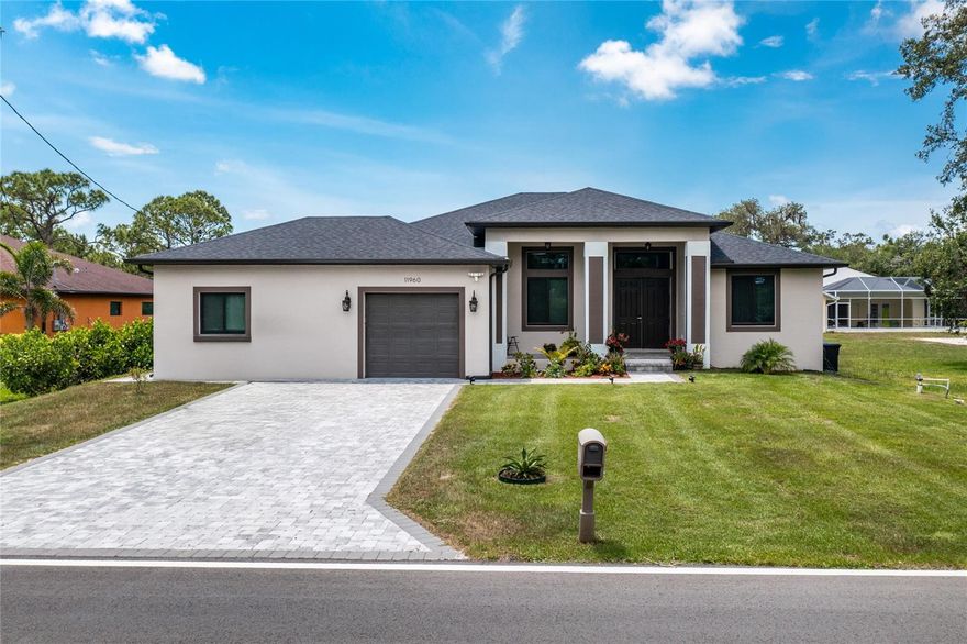 BUILT IN 2023 | MOTHER-IN-LAW SUITE | GOURMET KITCHEN | HURRICANE WINDOWS | 3-CAR GARAGE WITH BATHROOM | 3,288 TOTAL SF |
2,086 SF LIVING Welcome to this stunning 2023 custom-built home, where elevated design meets versatile living—just minutes from the healing waters of Warm Mineral Springs. From the moment you arrive, the home’s commanding curb appeal and elevated lot set the tone for what’s inside. Step into a space defined by soaring 10-foot ceilings, 8-foot interior doors, and hurricane-impact windows, creating a bright, open, and airy feel throughout. The heart of the home is the gourmet kitchen, featuring sleek LG appliances, elegant granite countertops, and abundant workspace—perfect for entertaining or everyday living. The main residence offers: 2 spacious bedrooms 2 full bathrooms Formal dining room Expansive living room The attached Mother-in-Law suite—ideal for extended family, guests, or rental income—features: 1 bedroom 1 bathroom Living area & full kitchen Private entrance Enjoy the versatility of the Florida room, upgraded with custom cabinetry and a built-in sink—an ideal retreat for work, play, or relaxation. The oversized 3-car garage includes a dedicated bathroom, providing unmatched convenience for outdoor work, hobbies, or gardening. Highlights Include: Built in 2023 Total Area: 3,288 sq ft Living Area: 2,086 sq ft 10' ceilings throughout 8' interior doors Hurricane-impact windows Gourmet kitchen with LG appliances & granite Private Mother-in-Law suite Florida room with custom built-ins 3-car garage with full bath This is more than a home—it’s a lifestyle upgrade. Don’t miss the opportunity to own a beautifully upgraded new construction in one of the most desirable areas of North Port. Schedule your private tour  today!