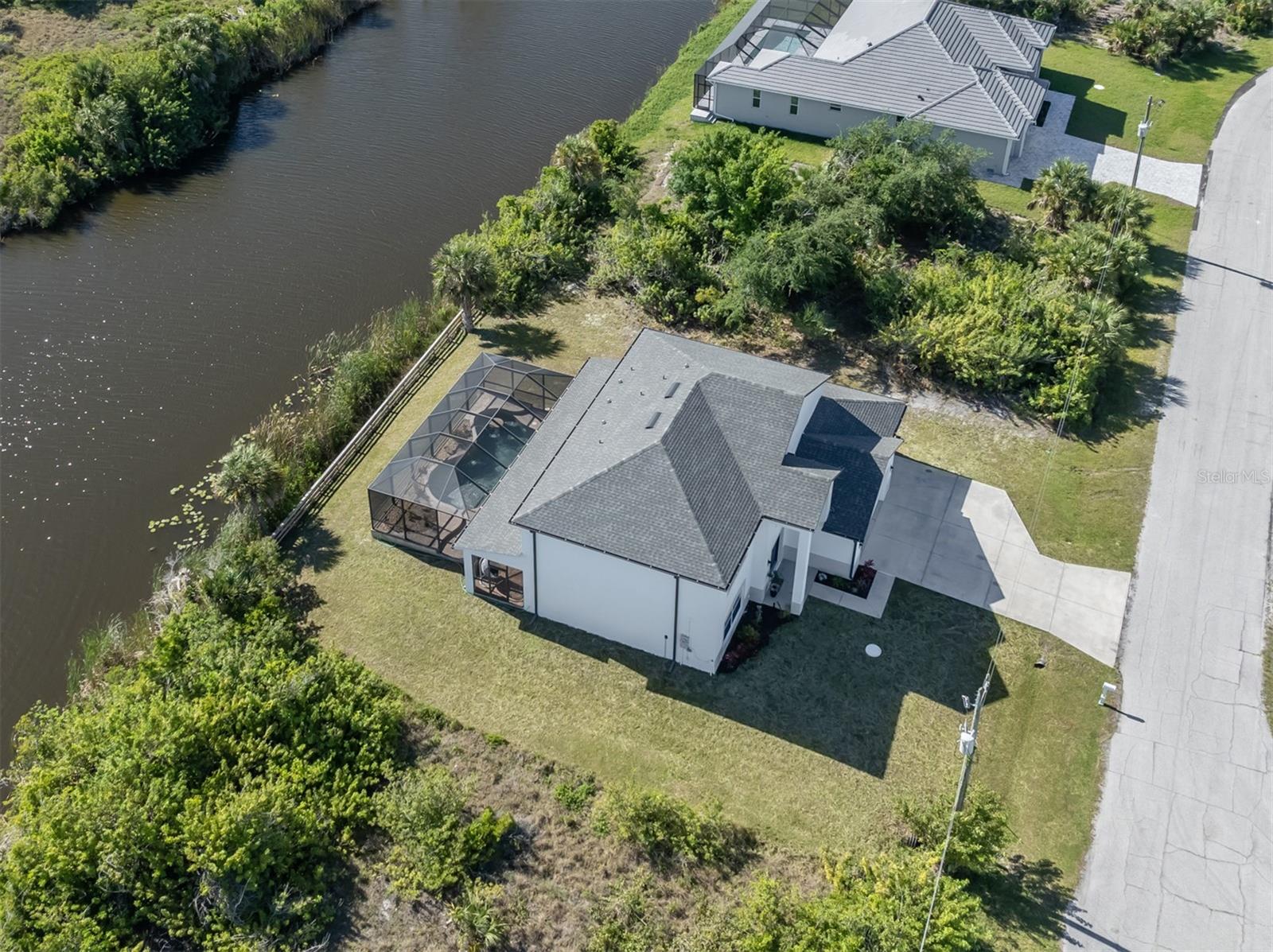 Gulf Cove in Port Charlotte. Four bedroom 3 and ½ half bath, pool, 3 car garage home nestled on a beautiful waterway. This beauty offers you the luxury of choice! It is available as a seasonal rental, or it is available for purchase. This is a very bright and spacious Great Room floor plan. The Kitchen is off of the Great Room and has a breakfast bar, granite counter tops and SS Appliances. Seriously roomy Kitchen. All of this overlooks a luxurious pool that is beautifully pavered and has enough room for al fresco dining and lounging. The Pool has serene water features (think ambiance) a sunning deck and an Island Bar for beverages. The bedrooms are on the second level and have breathtaking views. The Owners Suite is spacious with a walk-in closet, dual vanities, shower and a soaking tub. You have the ability to build a dock in the waterway, which leads to the Myakka River and to the Gulf of Mexico. Gulf Cove is conveniently located and is close to excellent shopping, dining, golfing and beautiful Gulf Beaches. The choice is yours: stay for a month or stay for a lifetime. Call for seasonal rates. Available 2025 Season.