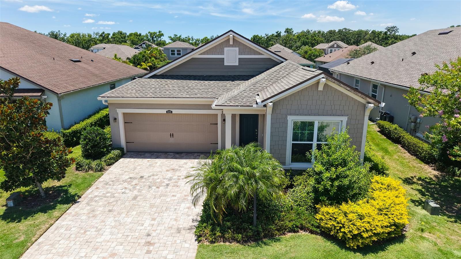 PARTIALLY FURNISHED 3-BEDROOM, 2-BATH POOL HOME IN GATED COMMUNITY!
Preferred Lender is offering 1% of the loan amount as a lender credit towards buyers closing costs or interest rate buydowns on this specific home! This beautifully maintained home offers effortless Florida living both inside and out including lawn maintenance. From the moment you arrive, the paver driveway, BRAND NEW ROOF 2024 and inviting entryway sets the tone for what’s inside. The open-split floorplan layout features stylish wood-look tile flooring throughout the main living areas and a kitchen equipped with an oversized island, gas range, granite countertops, subway tile backsplash, and stainless-steel appliances. Adjacent to the kitchen is a spacious dining area and comfortable living room, both of which have sliding glass doors to a stunning paver lanai. Enjoy the pool with plenty of deck space for tanning, expansive covered entertaining area plumbed for an outdoor kitchen and a fenced green space large enough and rarely found pool/yard combo in Lakewood Ranch to accommodate a kid's playground set, trampoline or brick paver firepit addition – perfect for relaxing or hosting guests. The generous primary suite offers a peaceful retreat with a large bedroom, bathroom with tiled walk-in shower, soaking tub, dual vanities, private water closet, and a walk-in closet. Quality furnishings and custom window treatments add an elegant touch. Move-in ready with nothing left to do, this home also includes access to Harmony’s community amenities – including a clubhouse, fitness center, playground, and resort-style pool. All of this located just minutes from the vibrant Lakewood Ranch lifestyle, top-rated beaches, parks, golf courses, cultural attractions, and top tier dining options in Waterside, University Town Center and Downtown Lakewood Ranch.