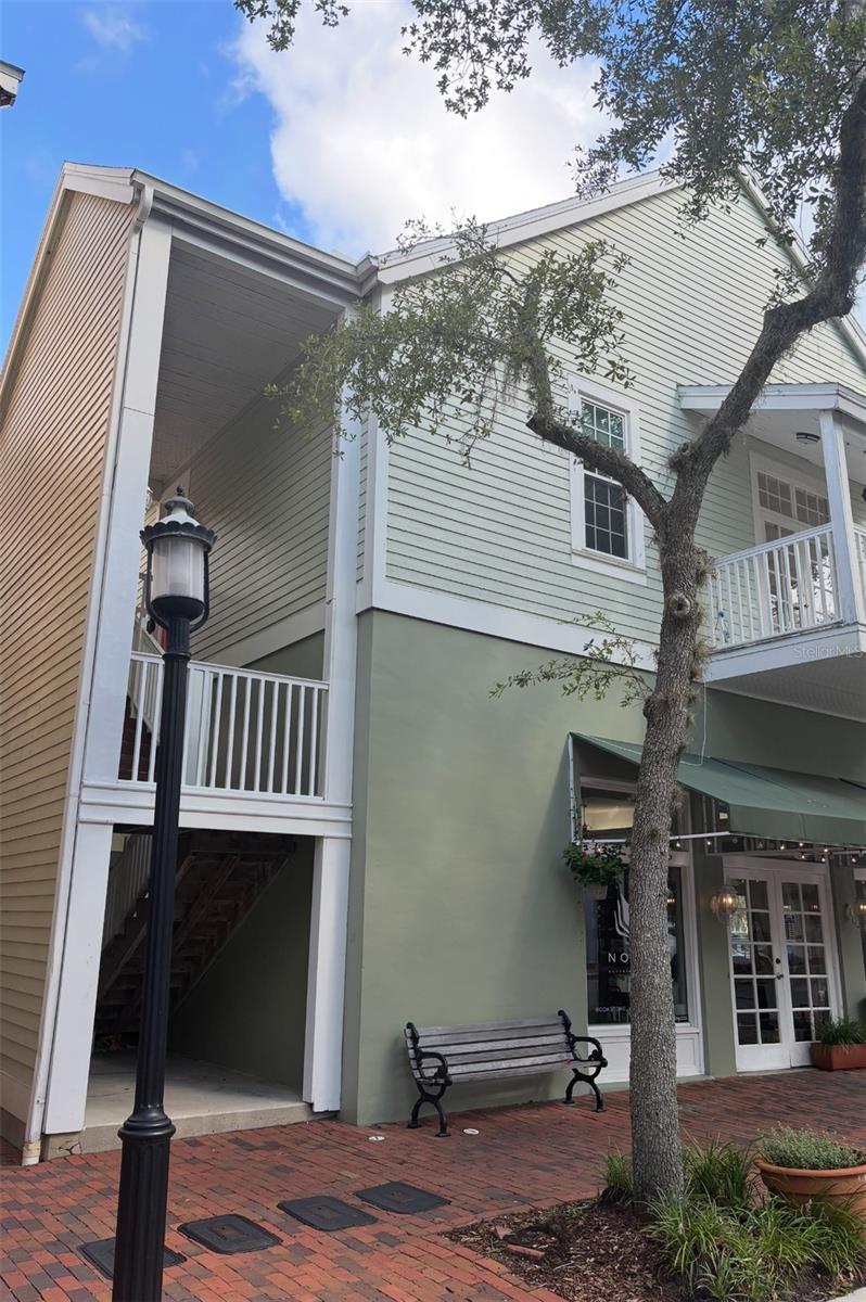 Don't miss this rare opportunity to live in the heart of the Haile Village Center, where you will have a bird's eye view of all of the activities, entertainment and seasonal events right from the privacy of your double balconies. Move in just in time to enjoy Oktoberfest, Light the Village a Christmas themed event and a weekly rain or shine Farmer's Market. This beautiful 2- bedroom and 2-bathroom condo features spacious and comfortable living spaces, with high ceilings, granite countertops in the kitchen, tile and wood flooring throughout and plentiful windows for a light and bright environment. The Haile Village Center offers a vibrant and convenient lifestyle where you will find restaurants, coffee shops, medical offices, hair salons, spas and so much more. This one is a must see and will not last long. Call today for your own private tour!