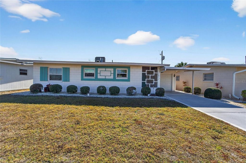 Photo of 1512 Chevy Chase Drive, Sun City Center, FL 33573 (MLS # TB8466953)